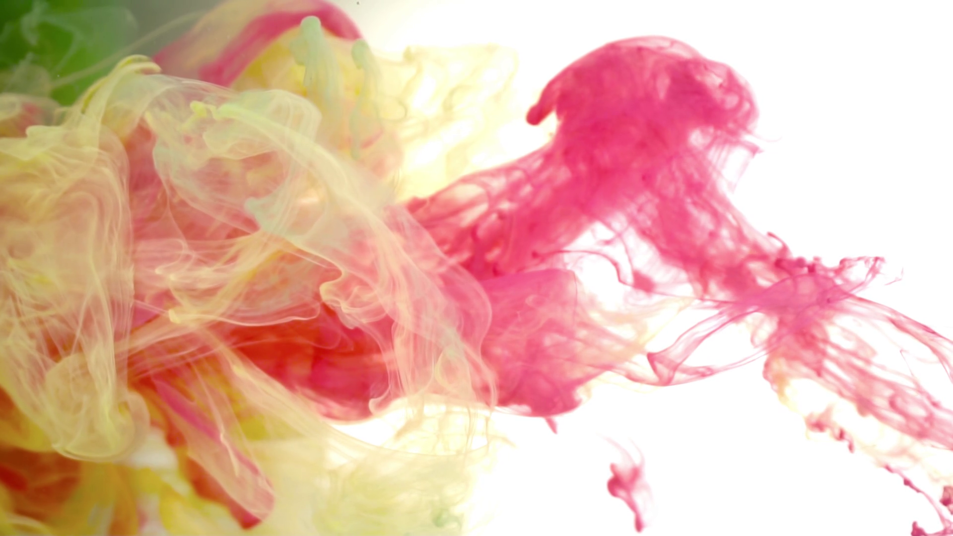 Black ink in colored water abstract background texture slow motion ...