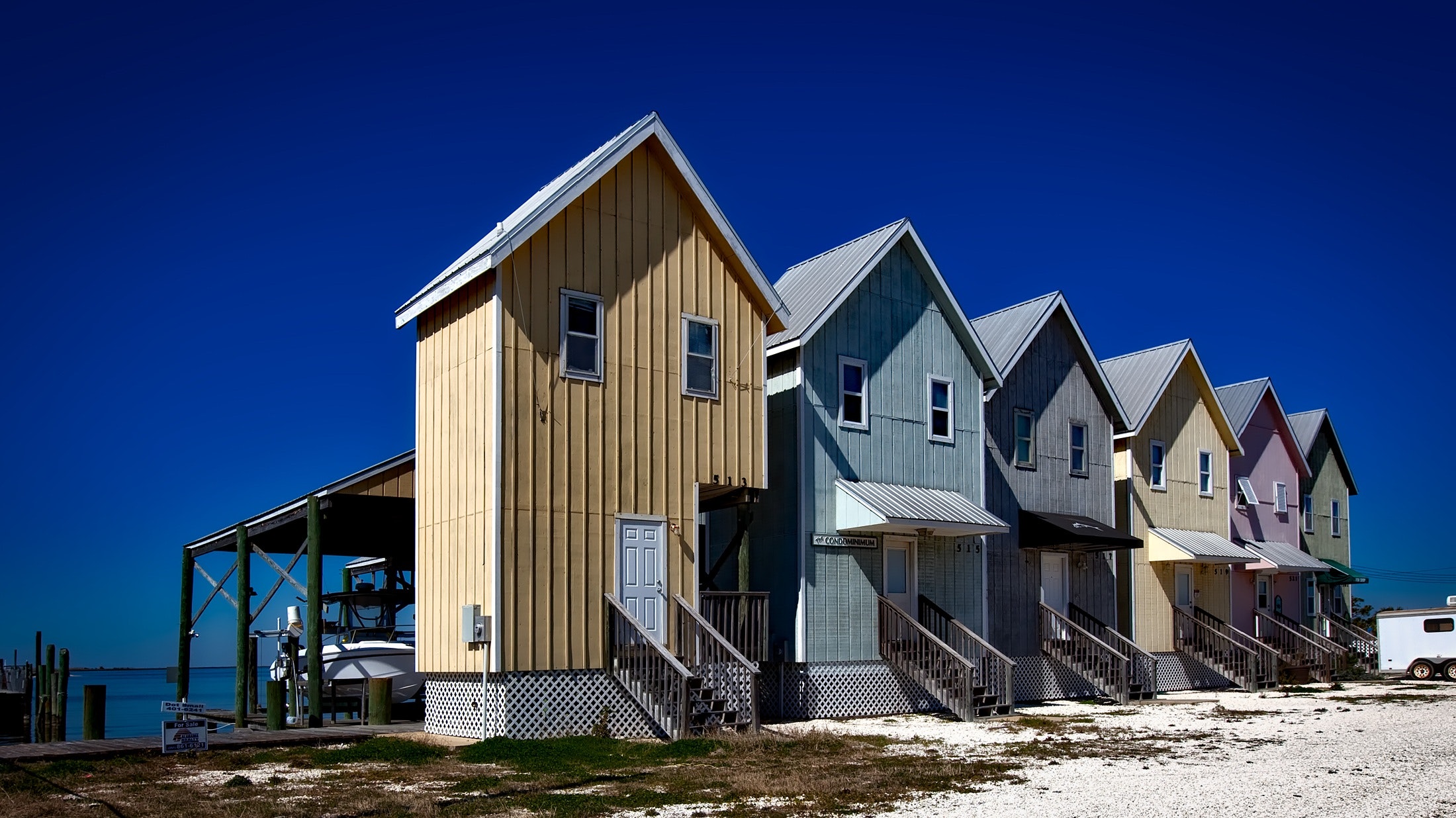 Inline house near seashore during daytime photo