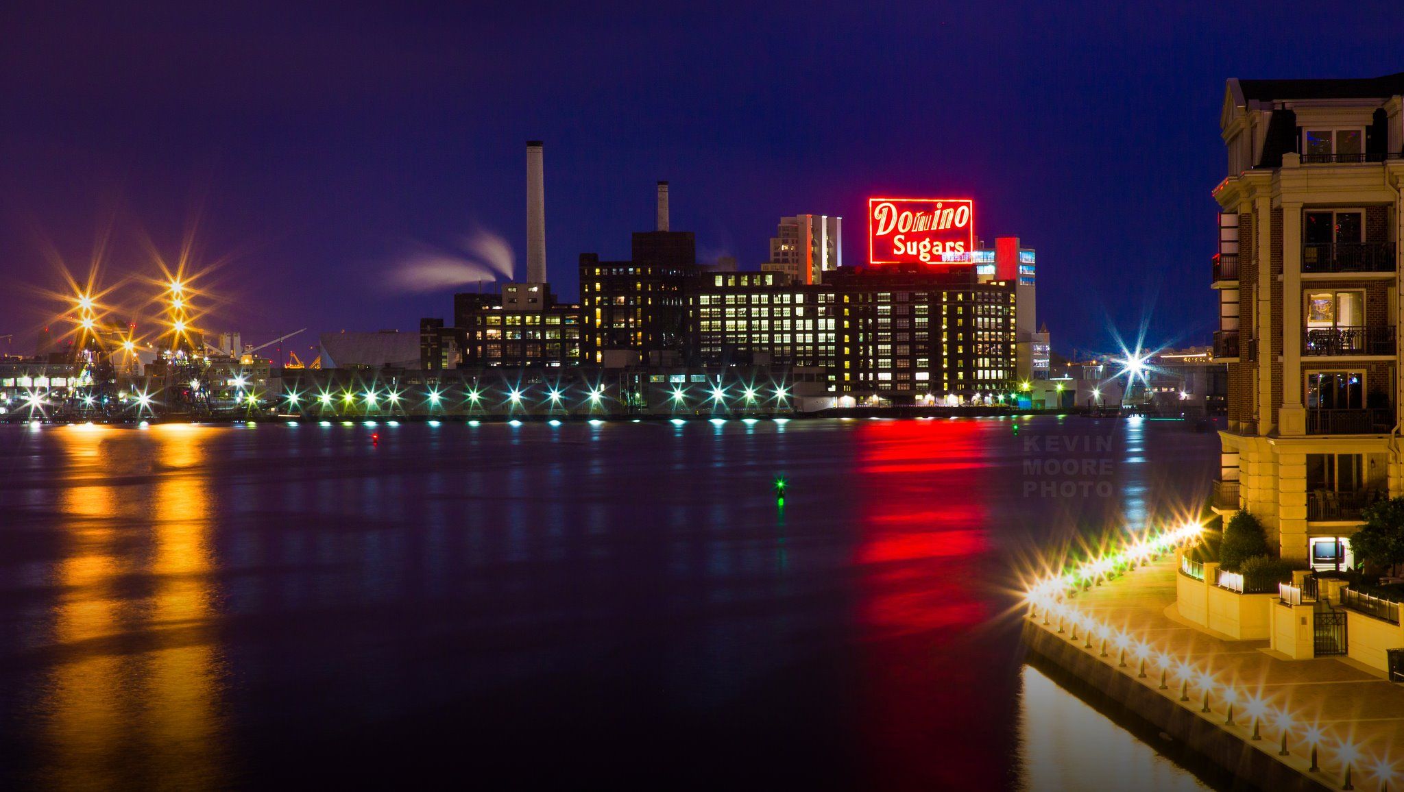 Domino Sugars sign across Baltimore's Inner Harbor. Photo by Kevin ...