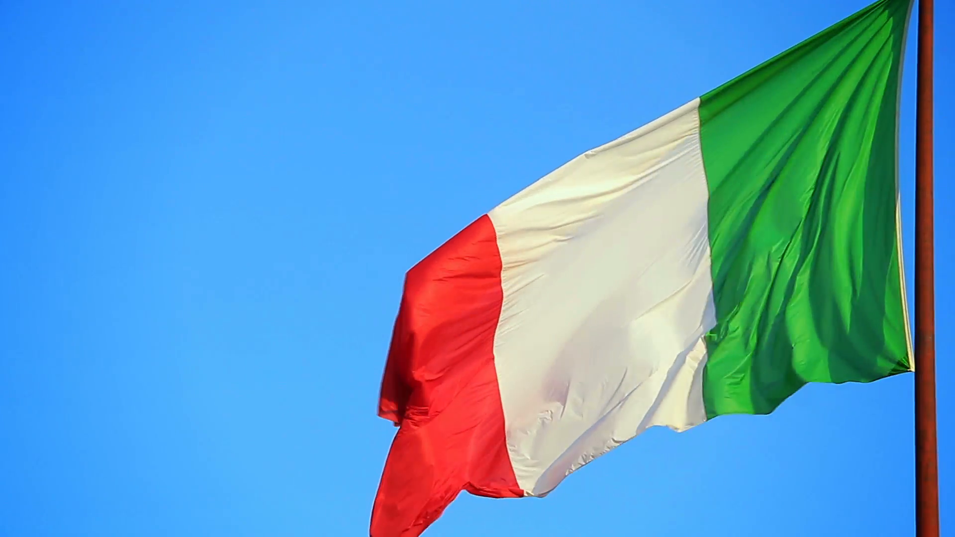 Italy, italian flag waving against a blue sky Stock Video Footage ...