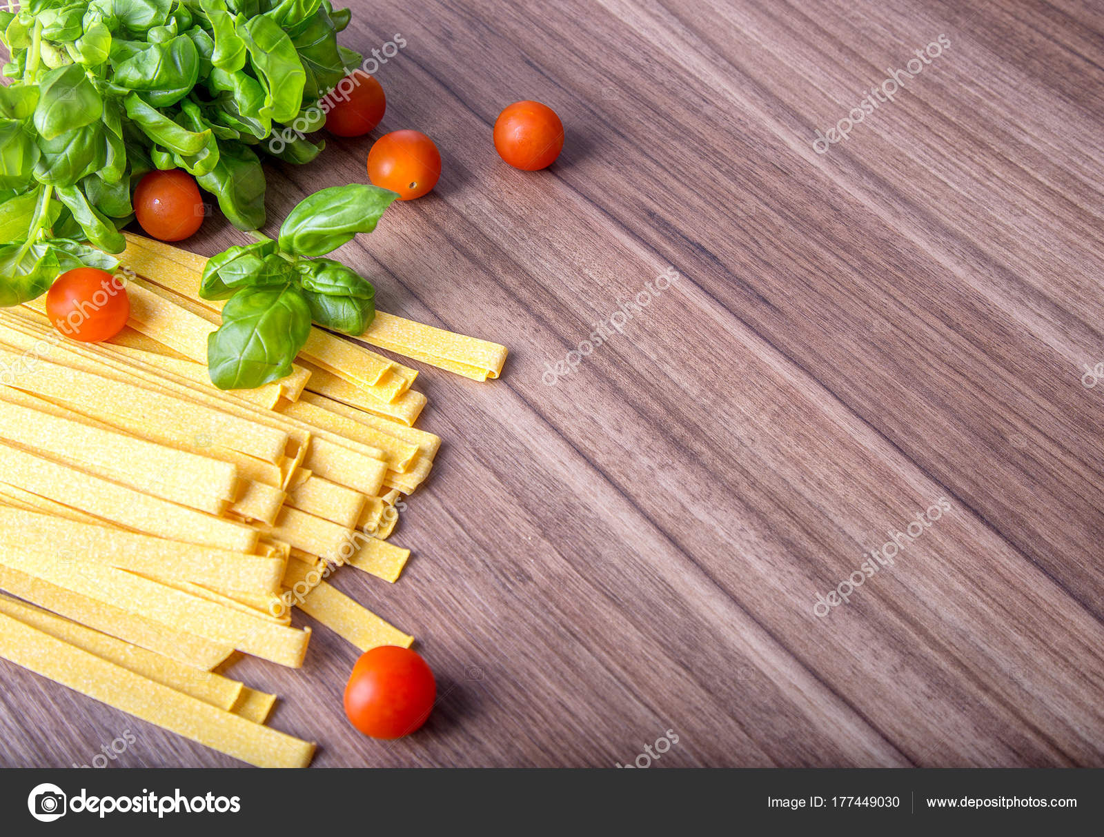 Italian food background with tomatoes, basil, pasta and cheese ...