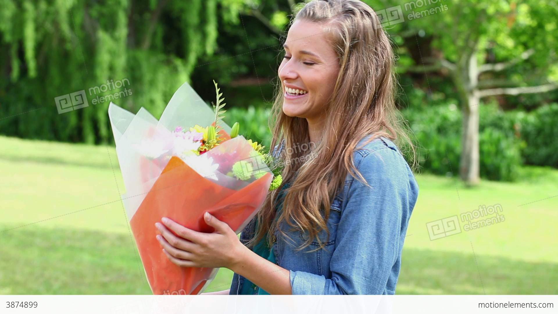Joyful Woman Receiving A Bunch Of Flowers Stock video footage | 3874899