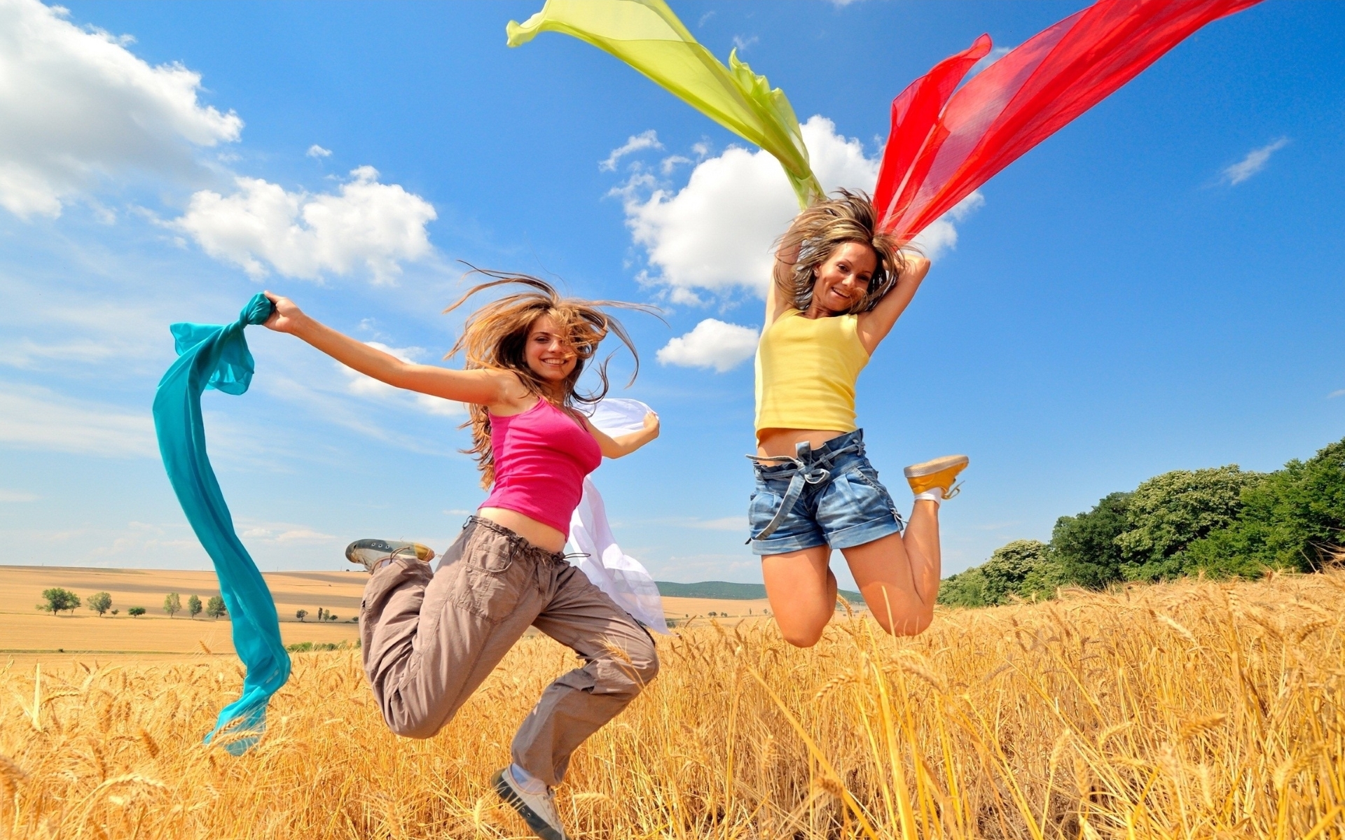 Two happy girls jumping on the field - HD wallpaper download ...