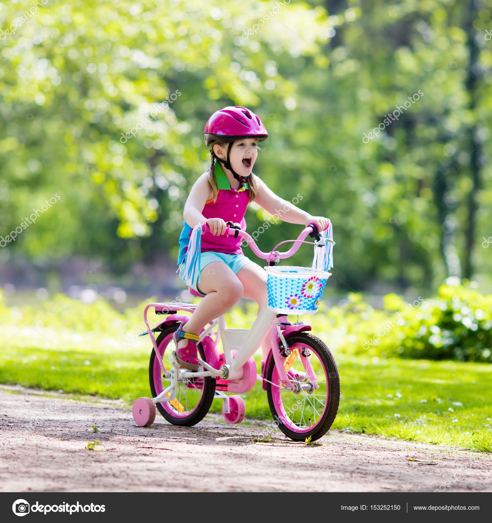 Child riding bike. Kid on bicycle. — Stock Photo © FamVeldman #153252150