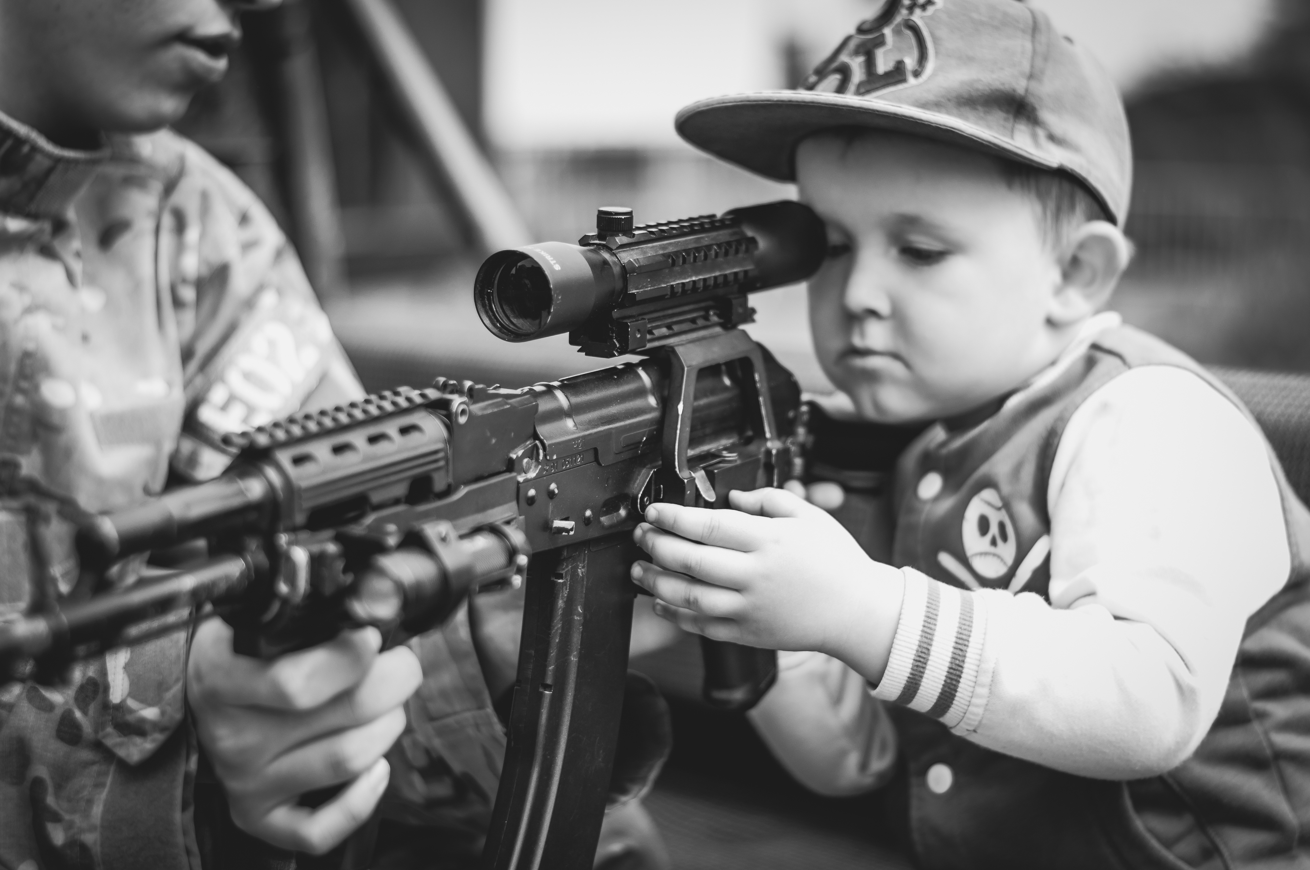 Kid using a gun photo