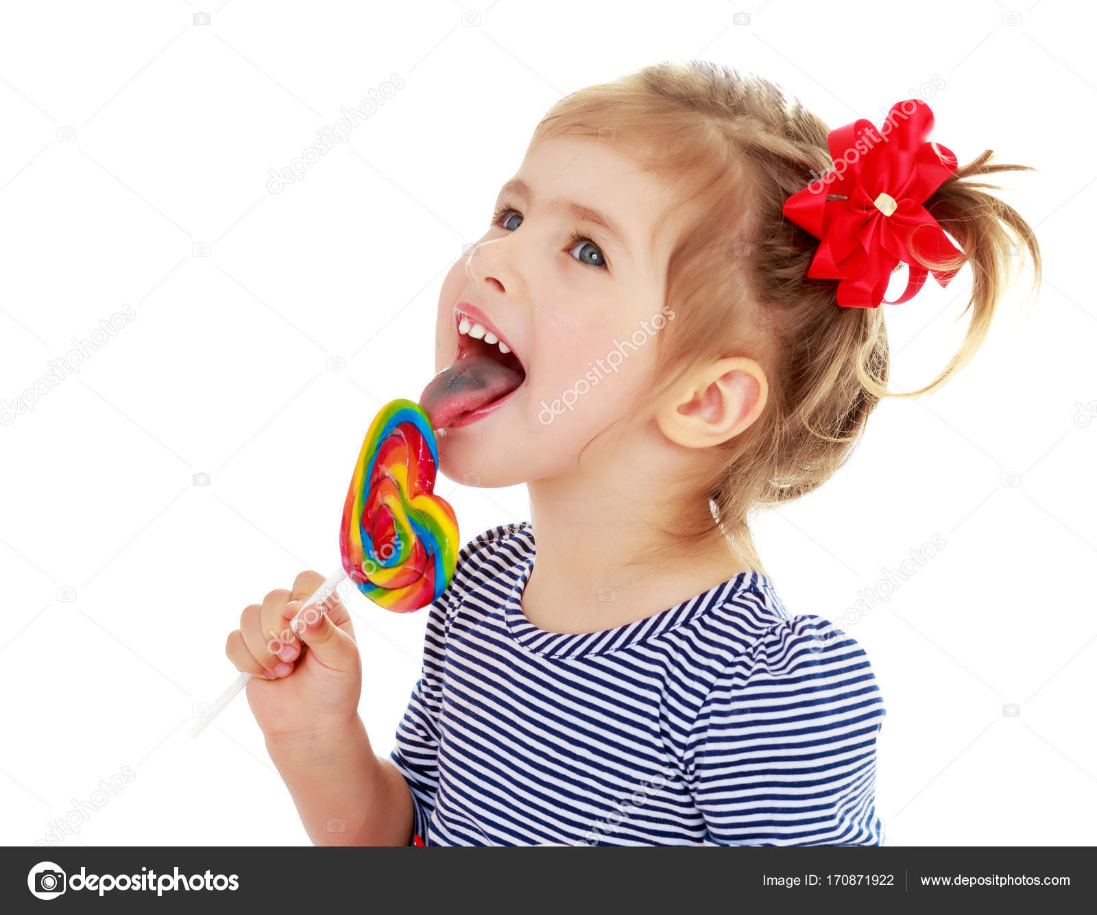 Girl licks candy on a stick — Stock Photo © lotosfoto1 #170871922