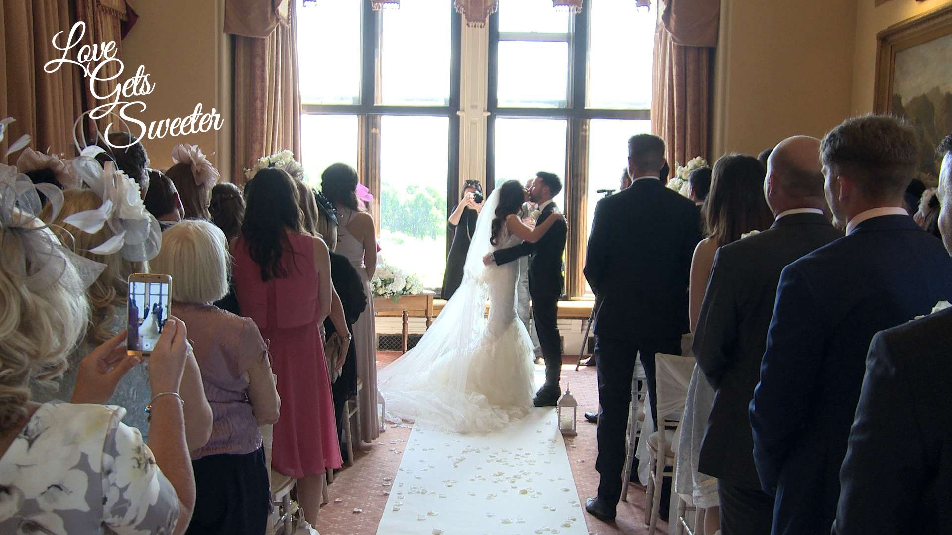 The classic 'you may kiss your Bride' moment at Armthawaite Hall in ...