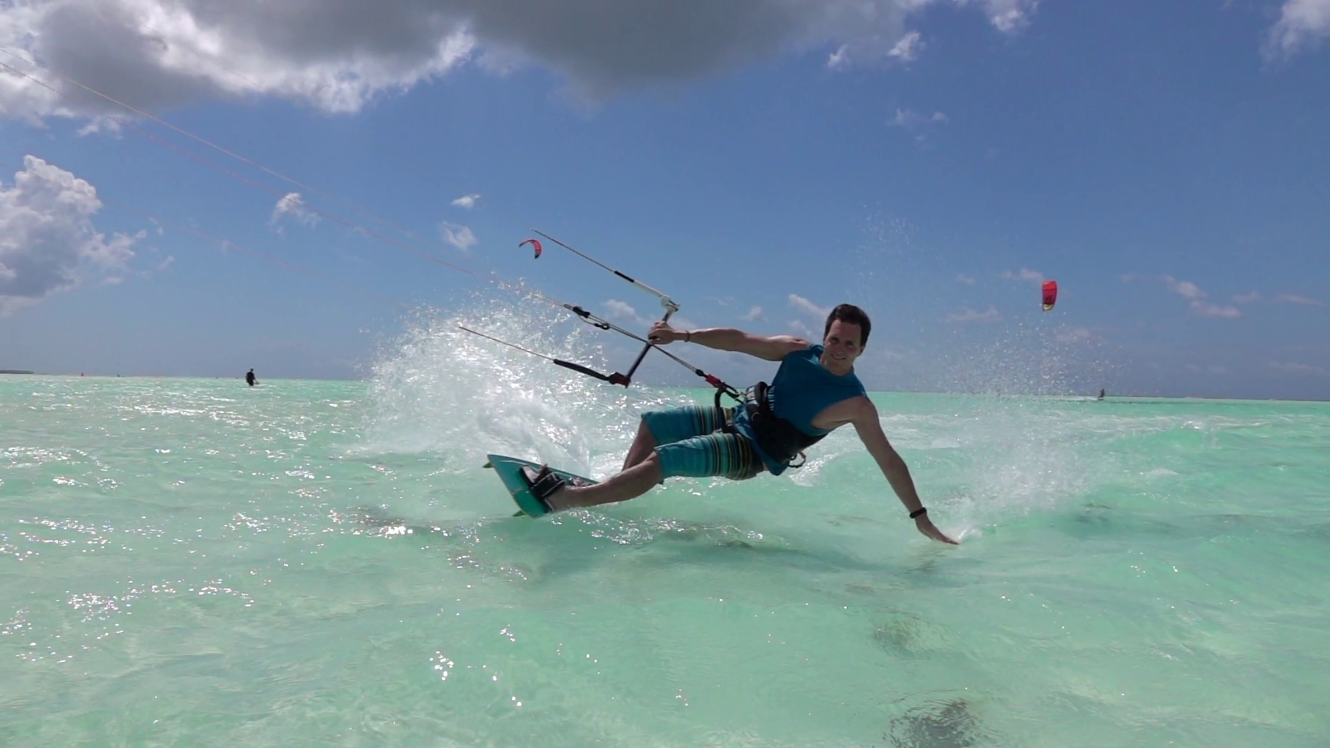 SLOW MOTION: Young kite surfer kiteboarding hand drag past the ...