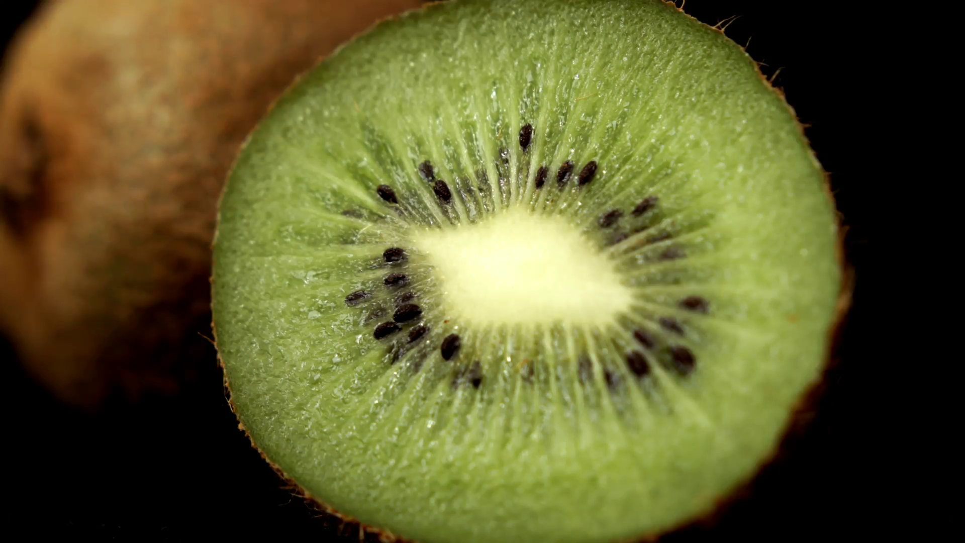 Sliced Kiwi fruit isolated against a black background HD stock ...