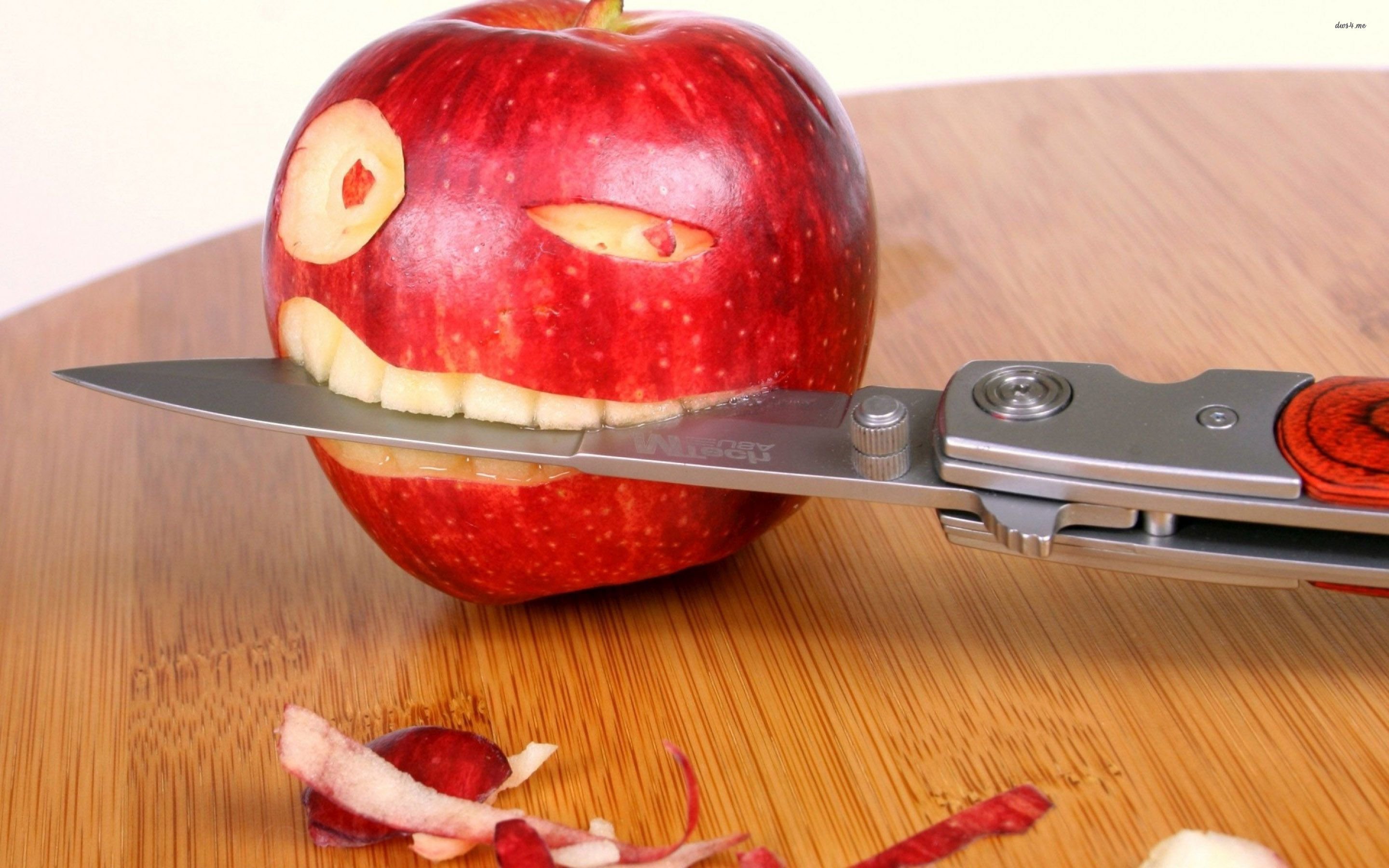 Apple Biting A Knife - WallDevil