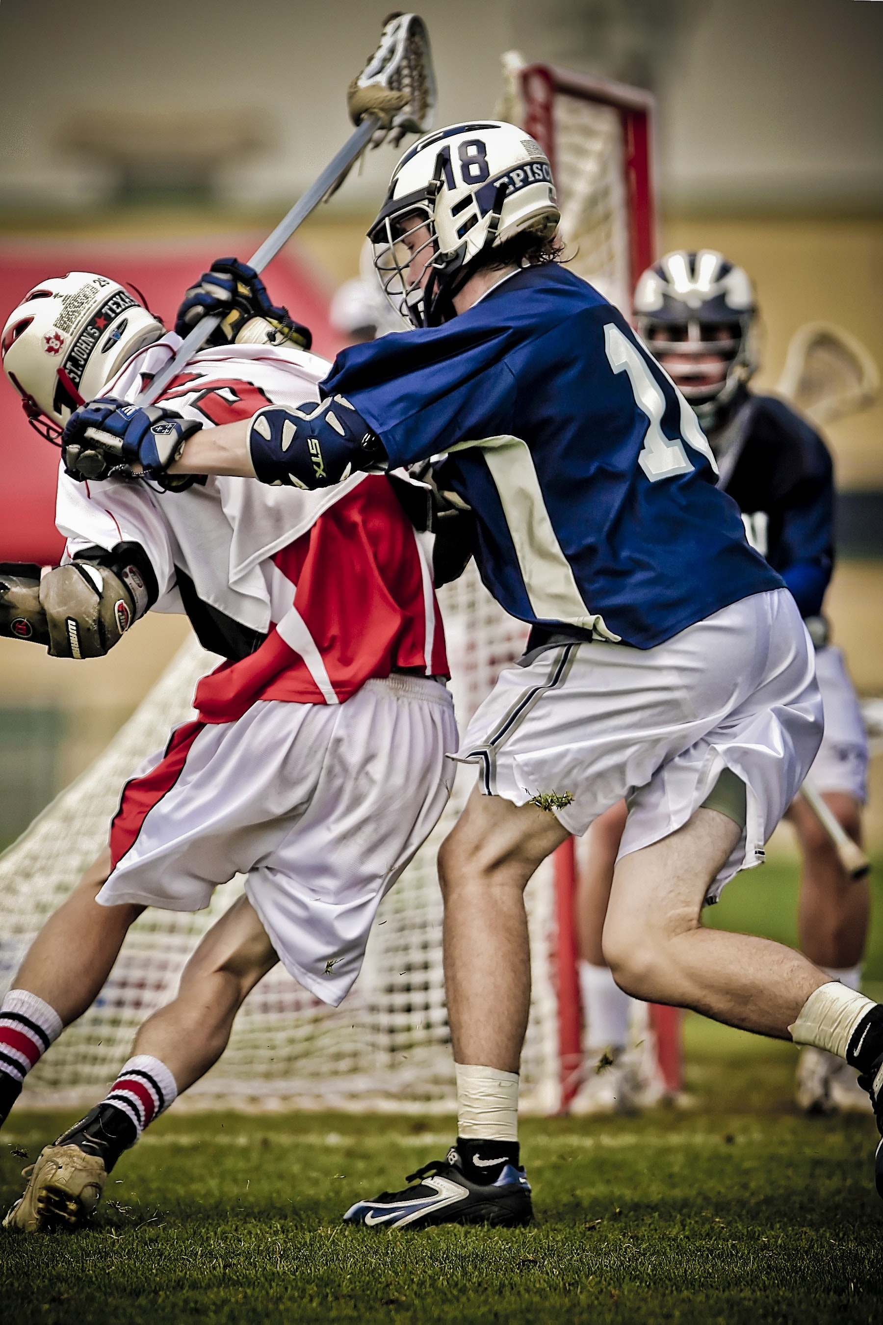 Lacross player battling on the field photo