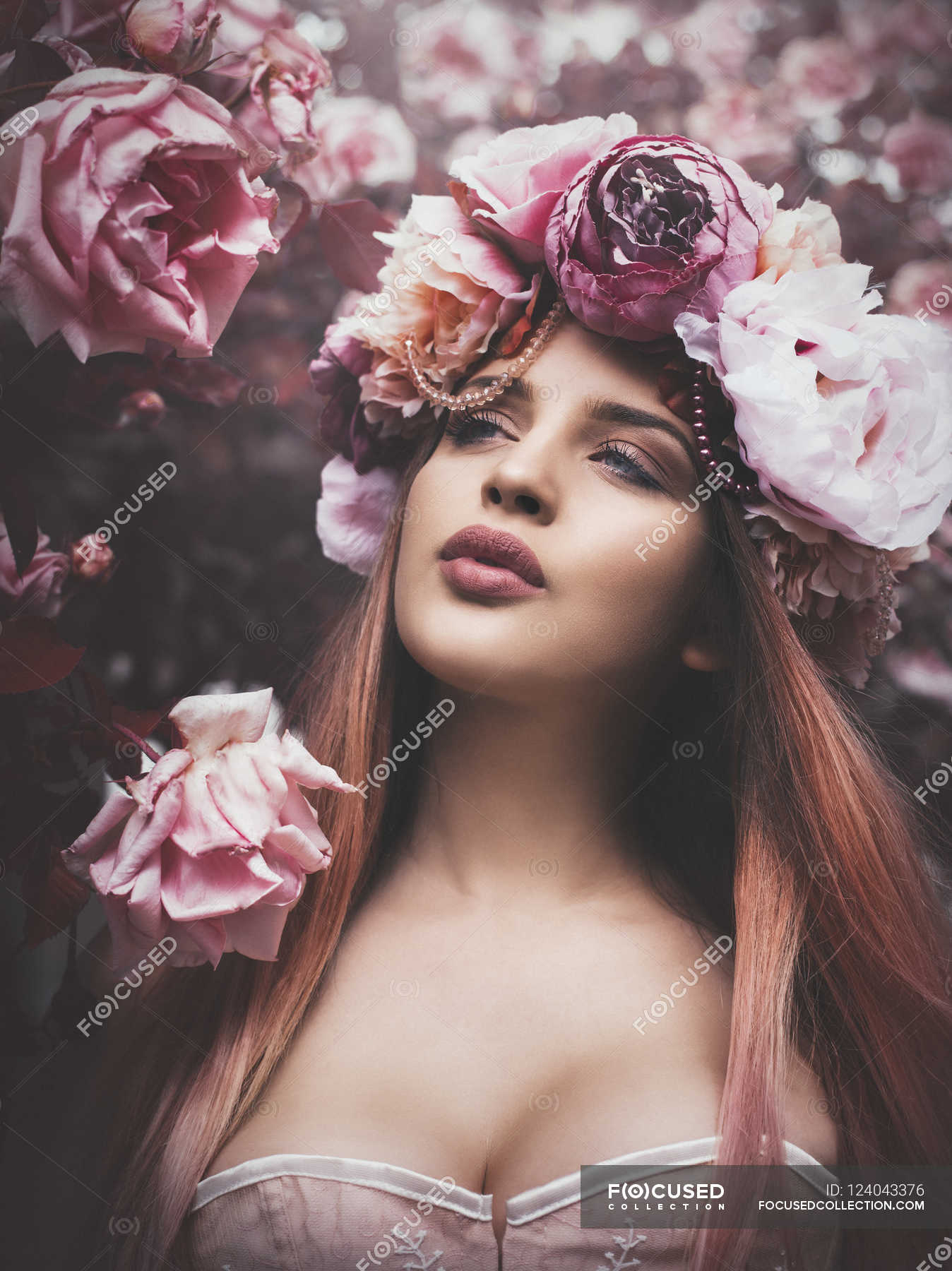 Sensual woman wearing flowers on head — Stock Photo | #124043376