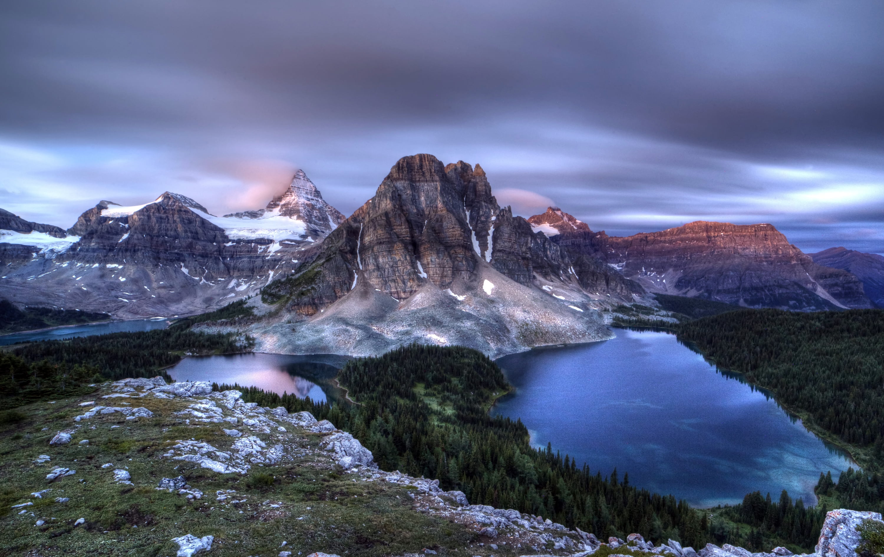 Landscape photography of gray mountain near body of water under gray ...
