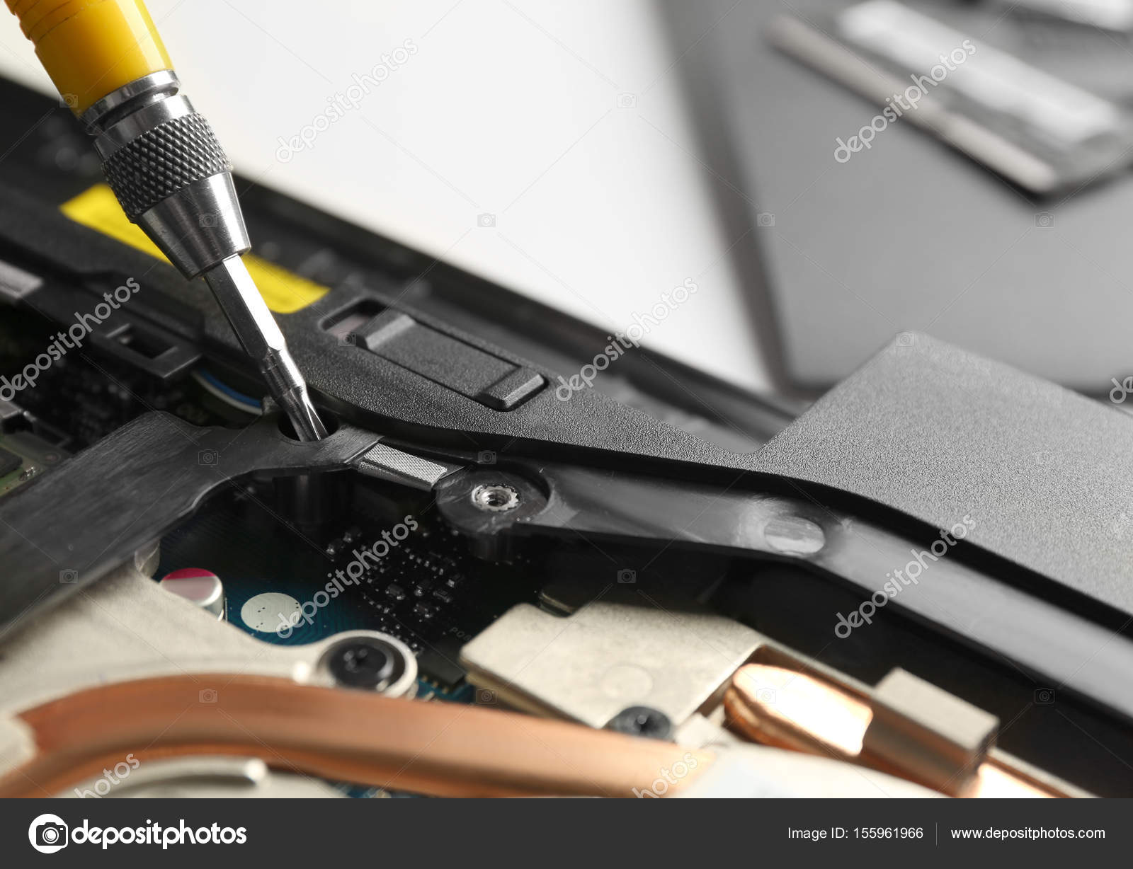 Disassembling laptop with screwdriver — Stock Photo © belchonock ...