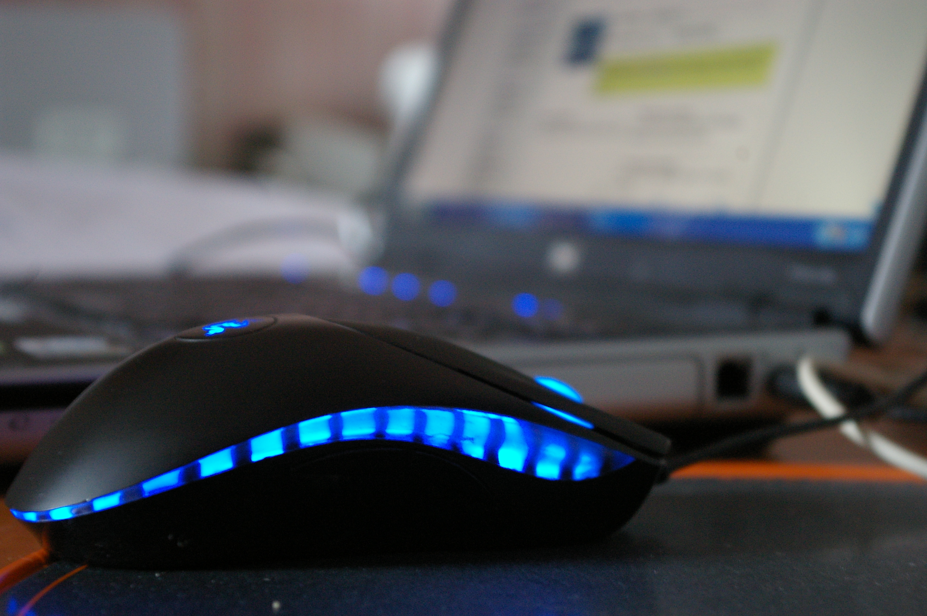 Laptop with blue mouse photo