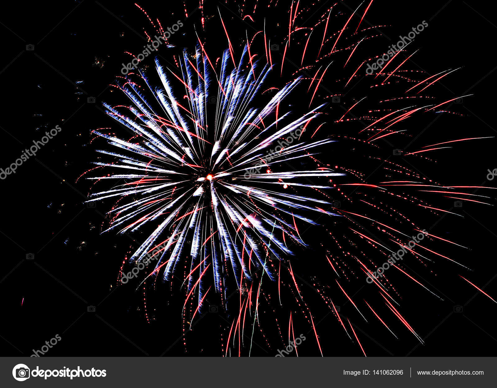 A large display of fireworks light the sky on the 4th of July ...
