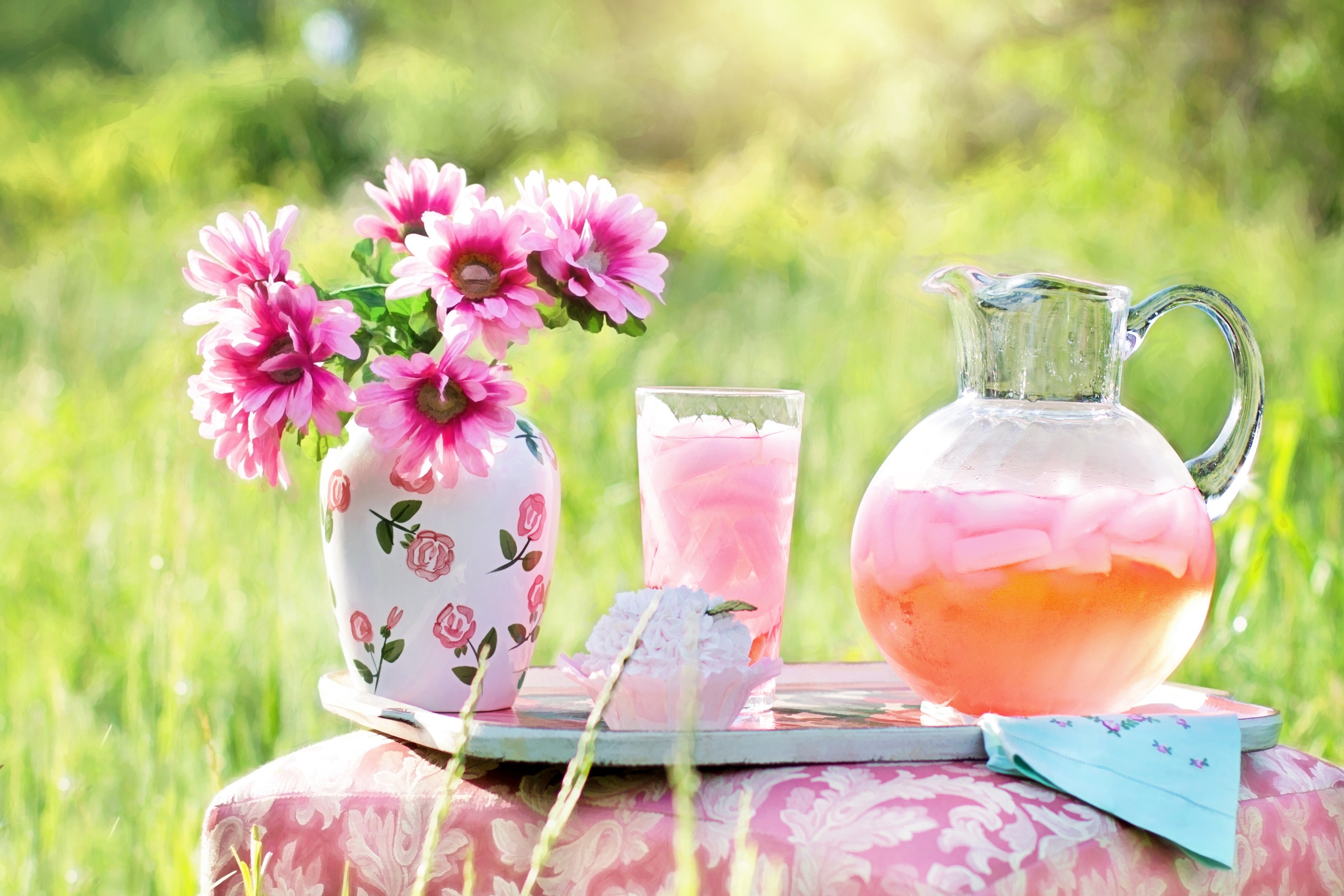 Lemonade and flowers on the tray photo
