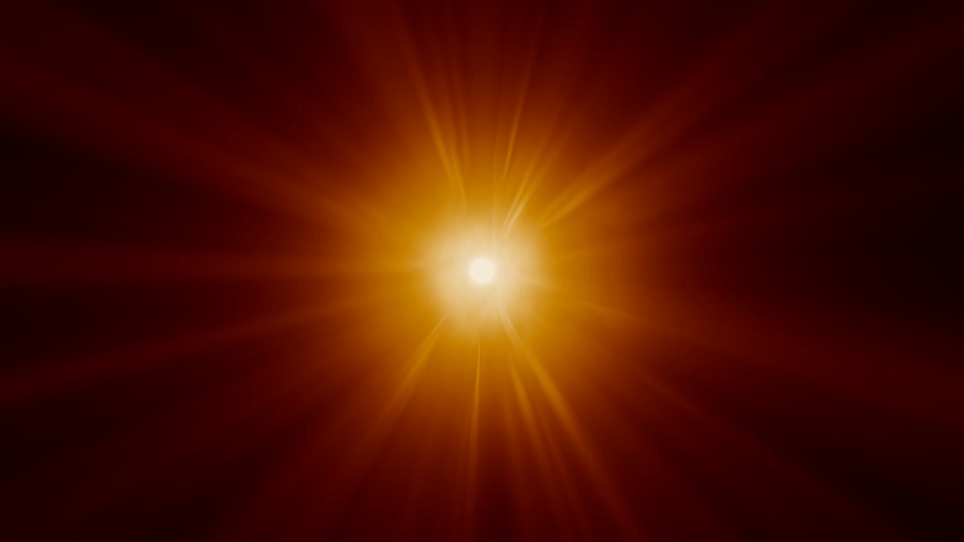 Orange rays of light flare outwards, making a sun-like effect ...