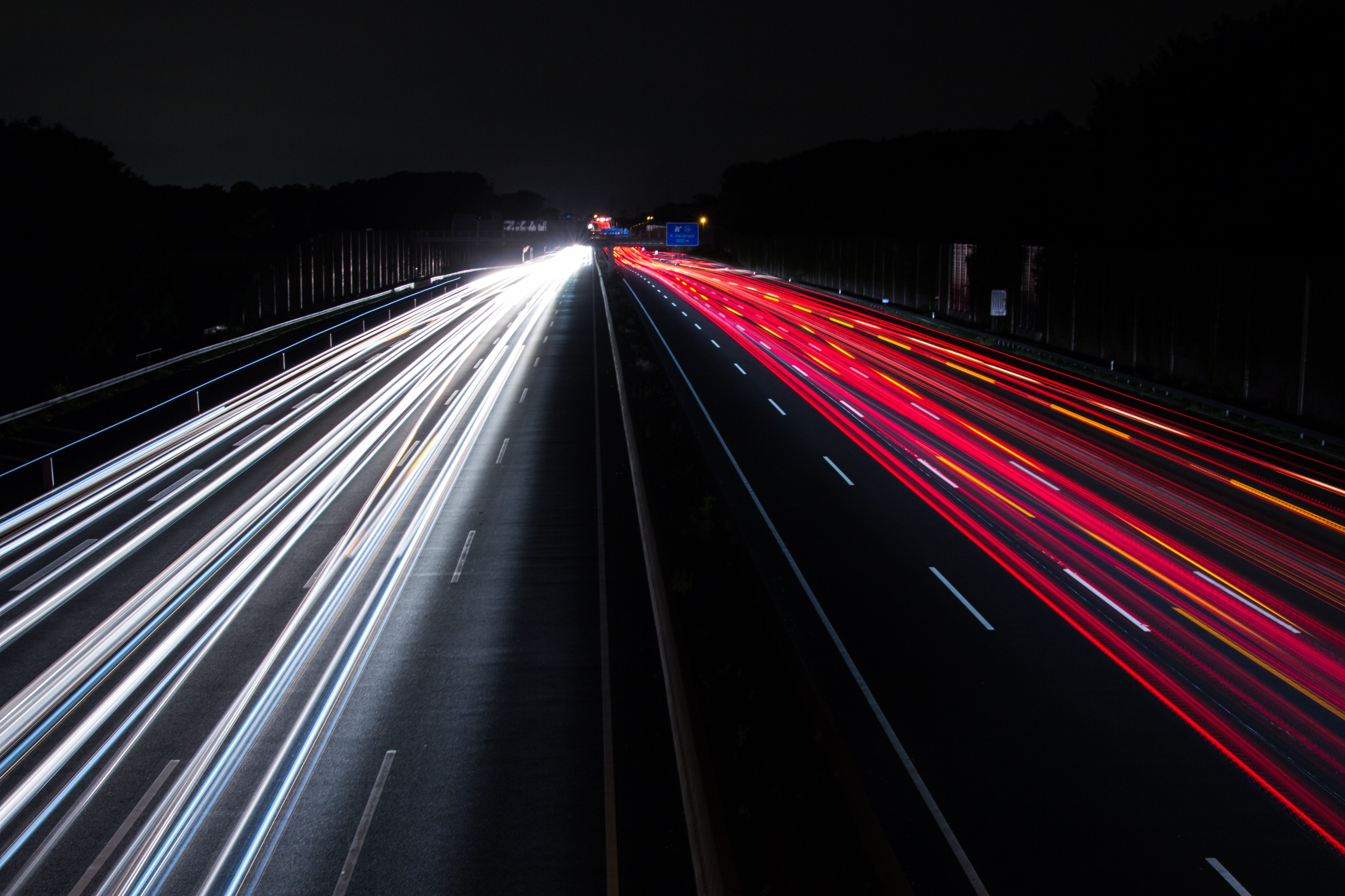 Light trails on highway at night photo