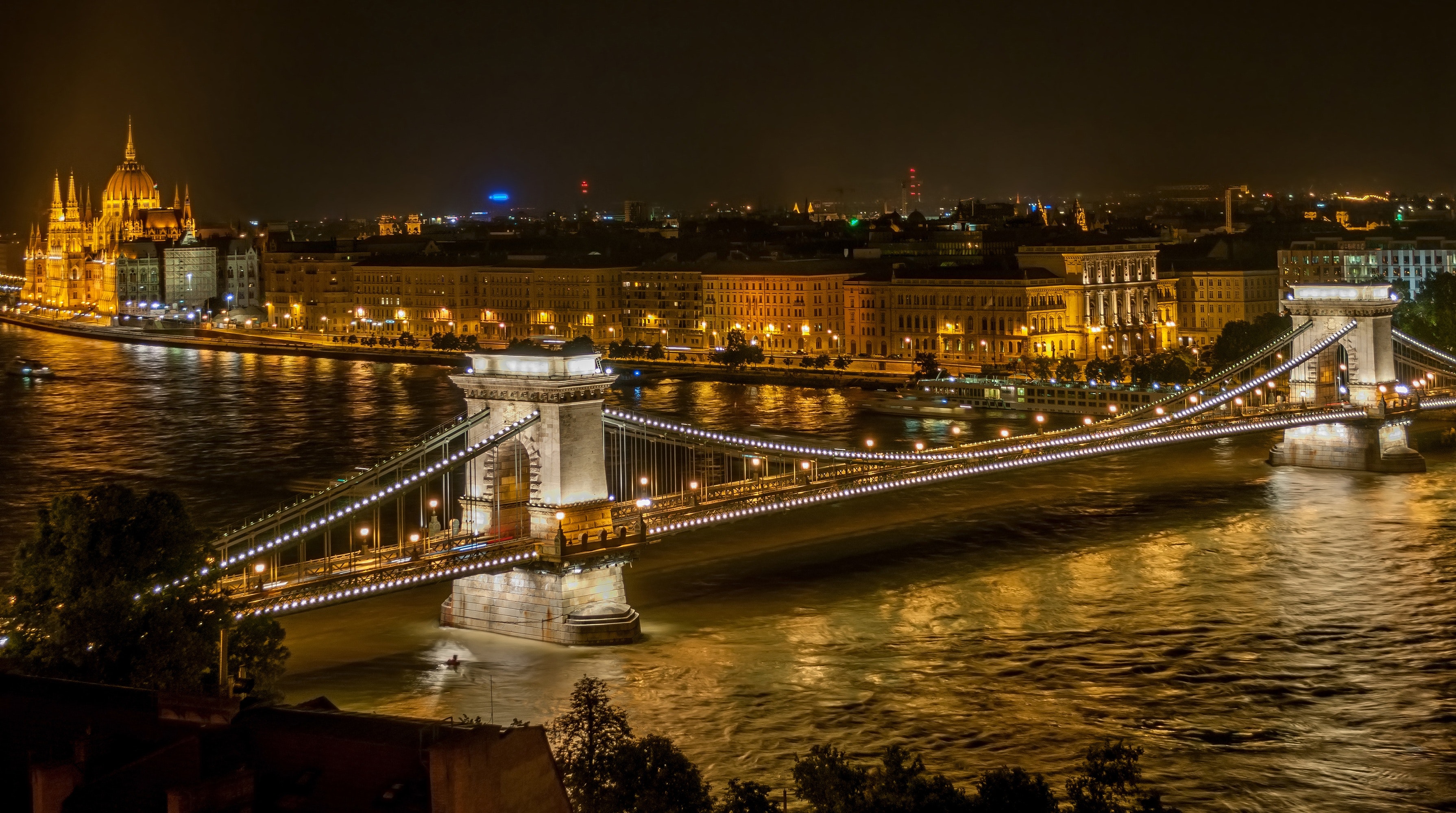 Lighted bridge during night time photo
