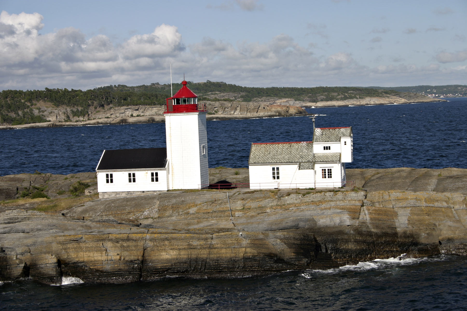 Lighthouse on cliffs photo