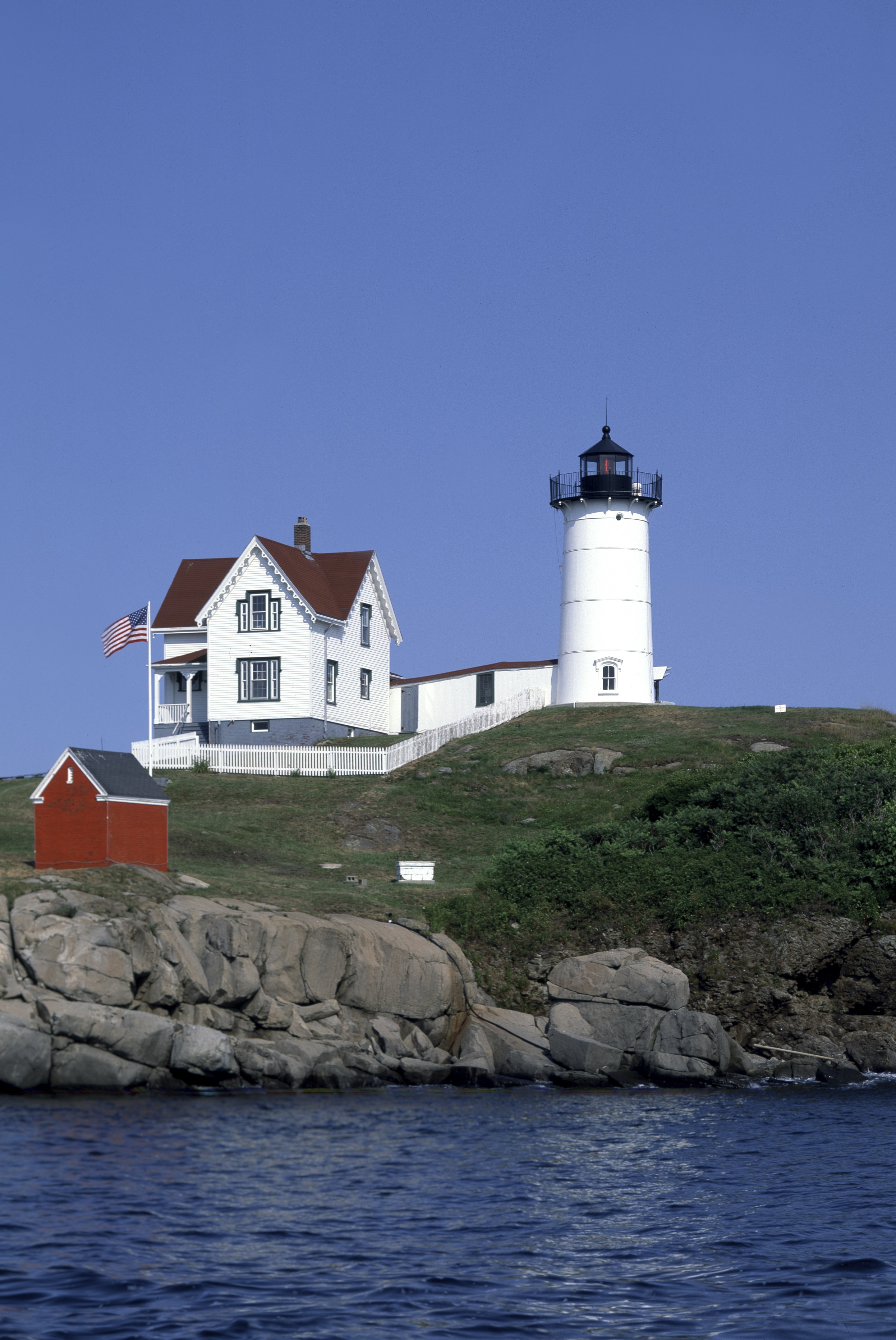 Lighthouse on the seashore photo