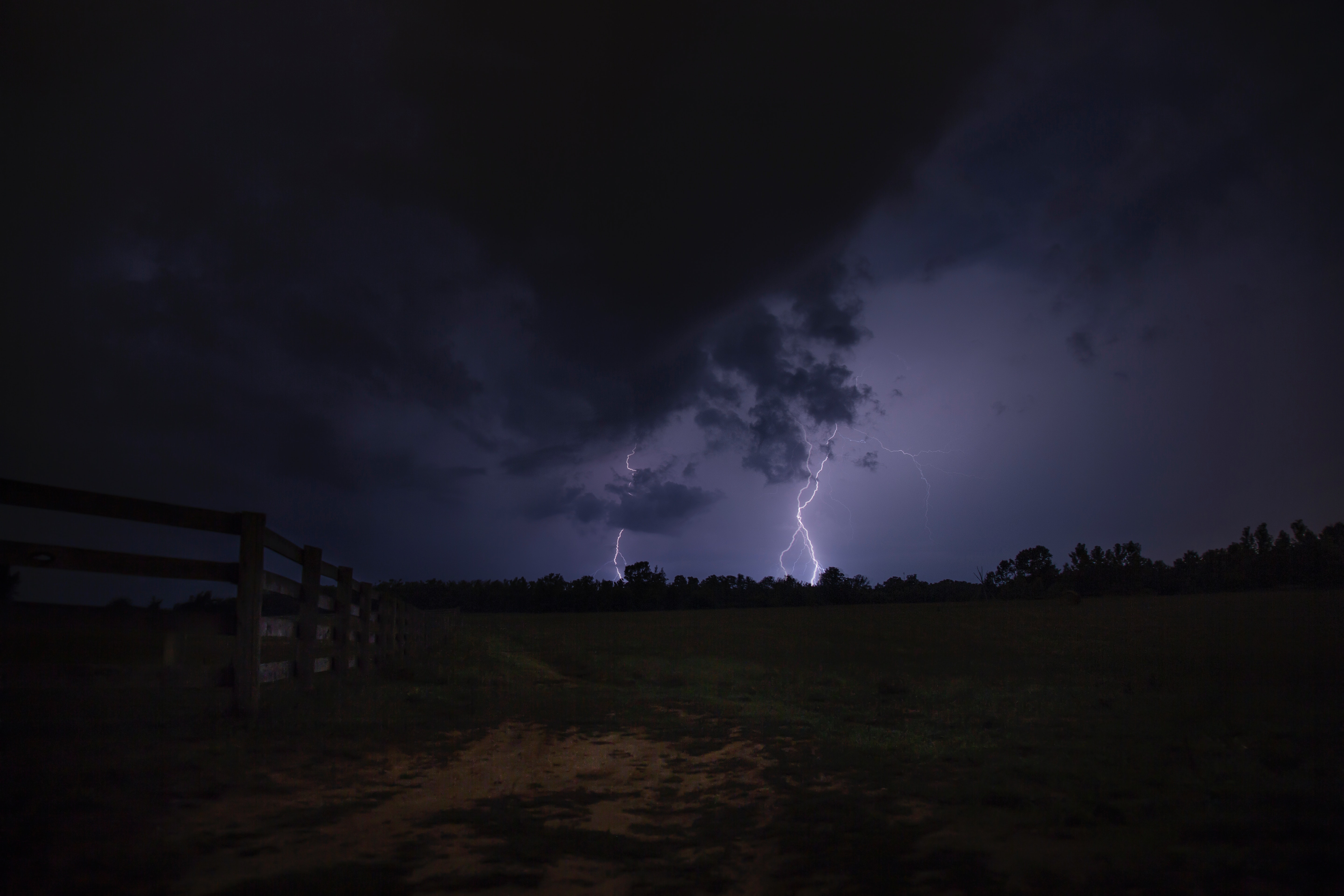 Lightning strike the ground during night time photo