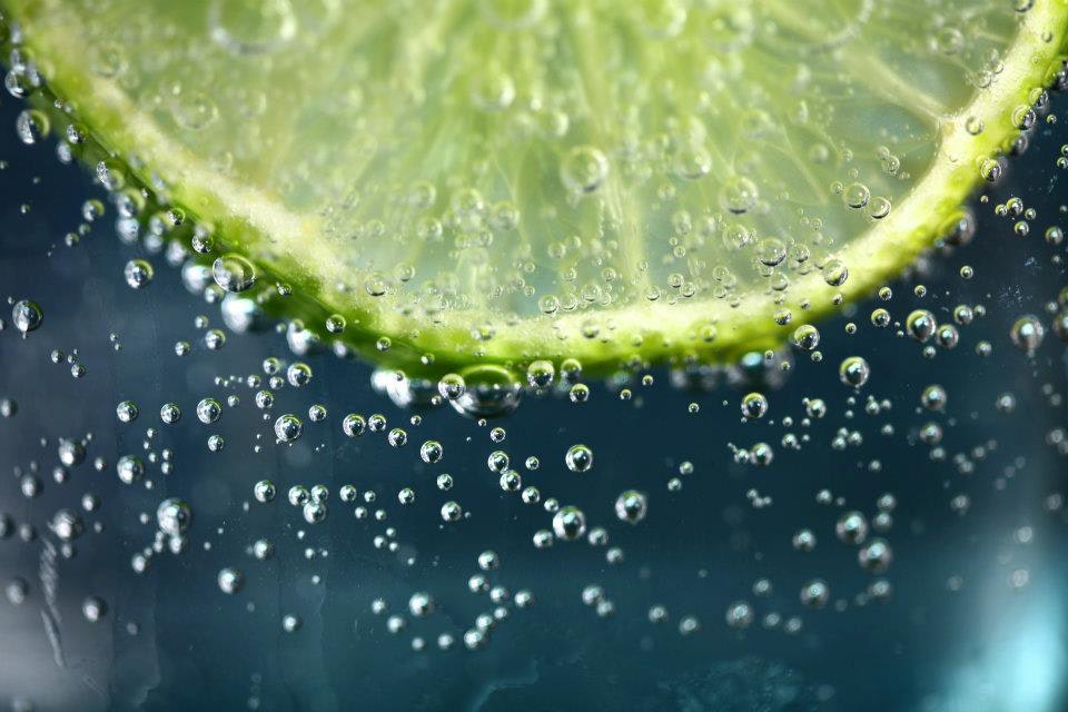 Lime slice on water photo
