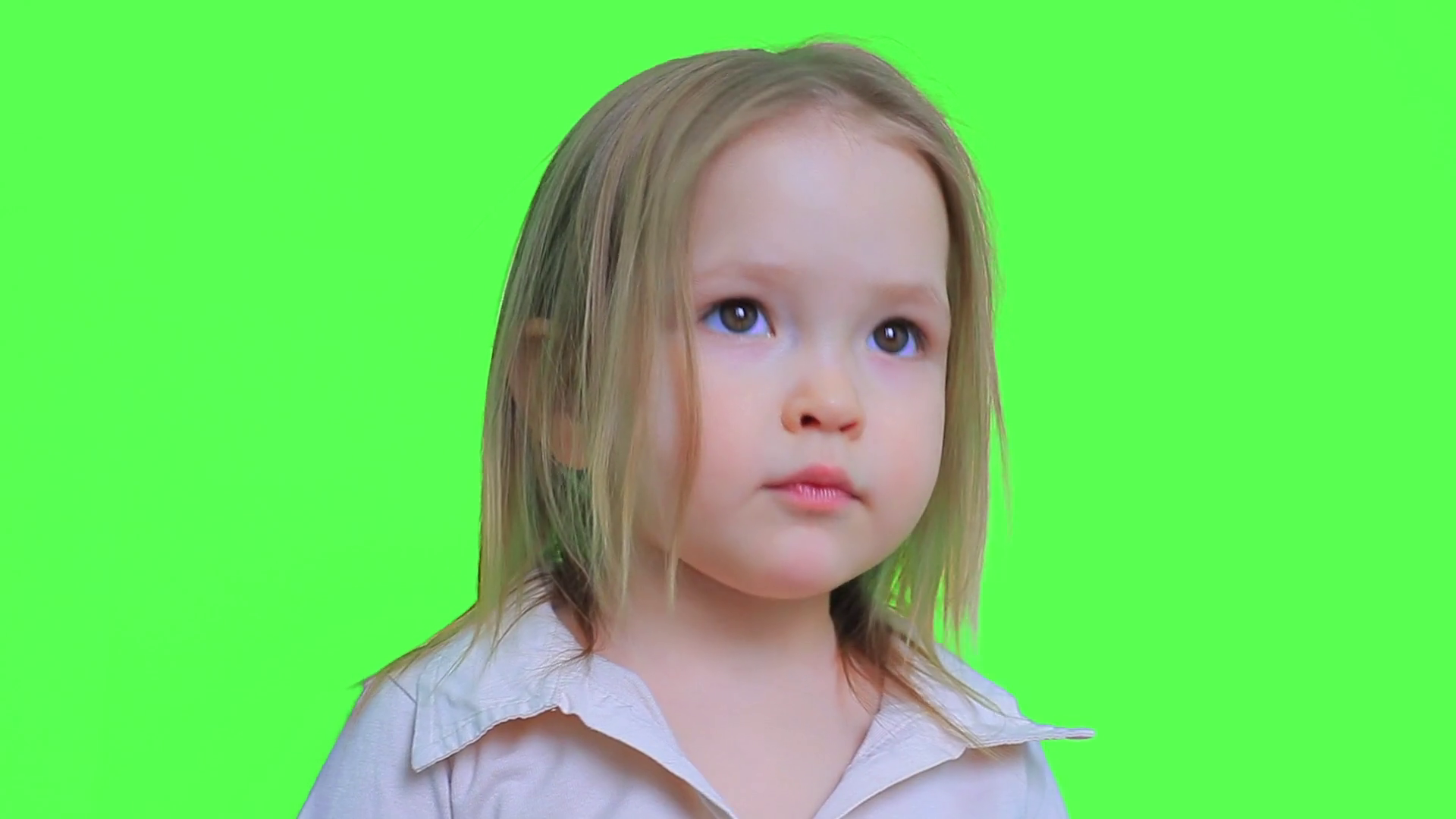 Little Blonde Girl Looks up and Surprised on a Green Screen Stock ...