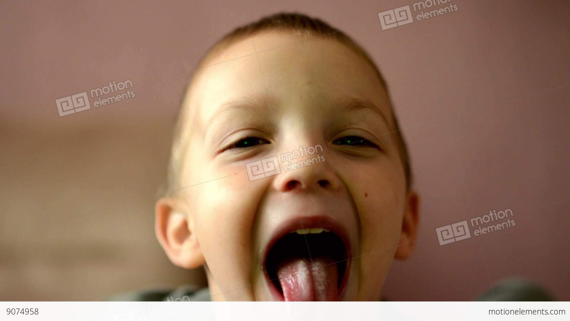 Child Sticks Out His Tongue (little Boy) - Interior (sofa) Stock ...
