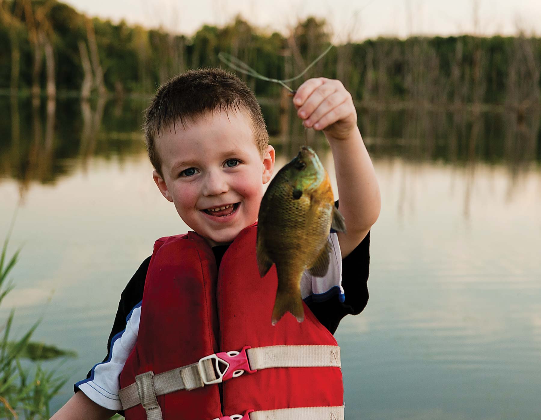 Little Boy with Fish | MDC Hunting and Fishing