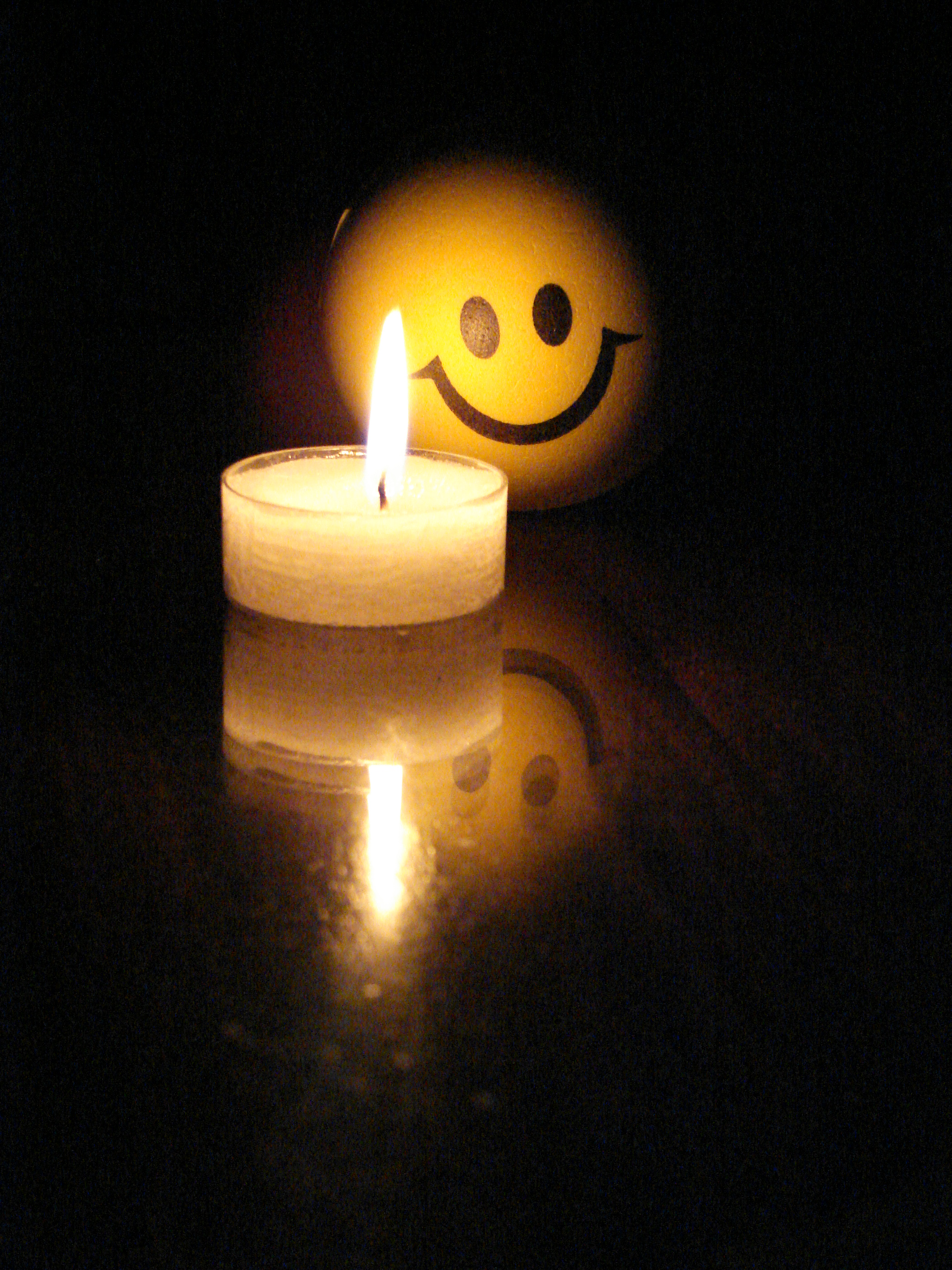 Little candle with funny face photo