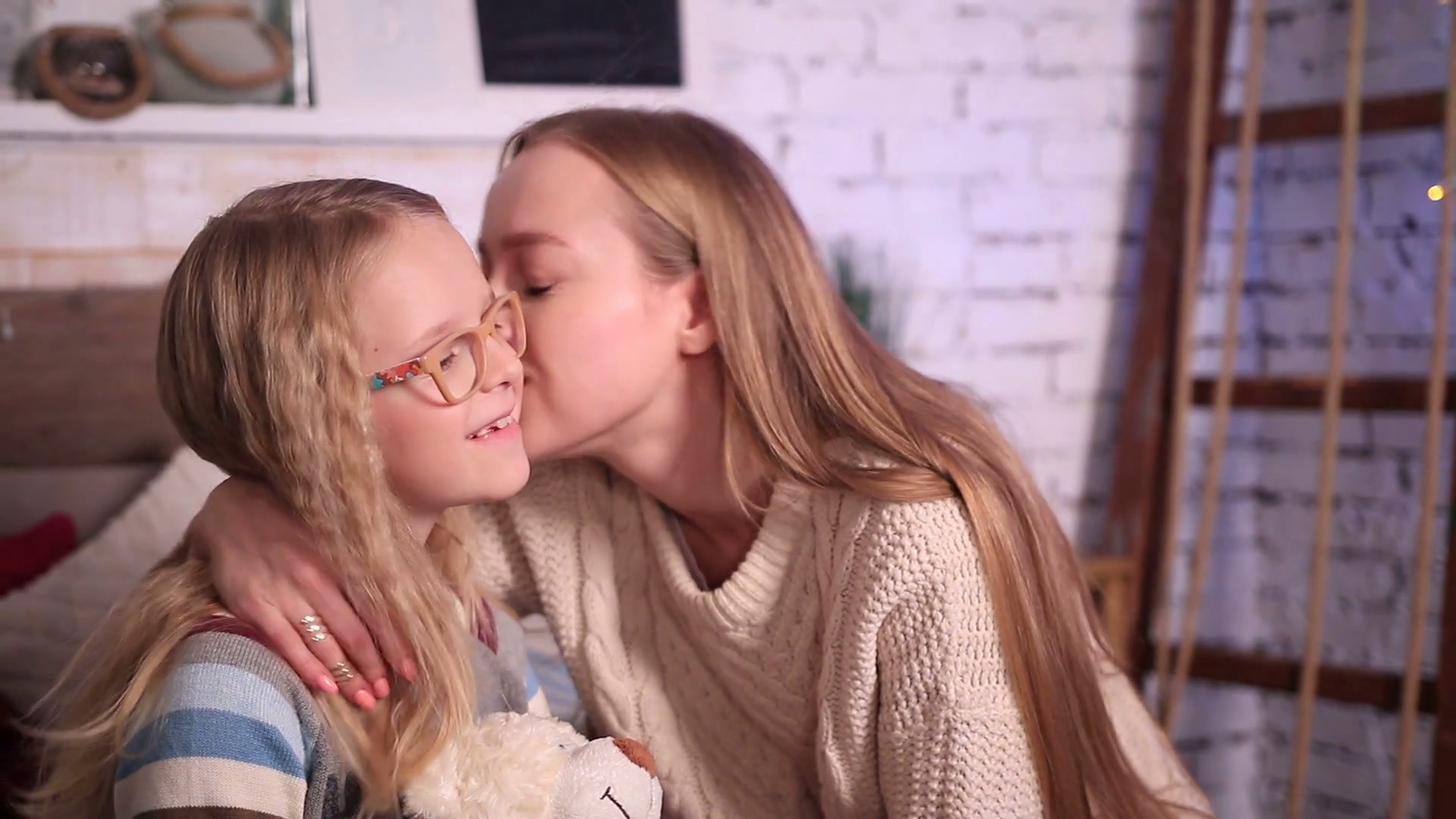 Mother kissing happy little daughter's cheek Stock Video Footage ...