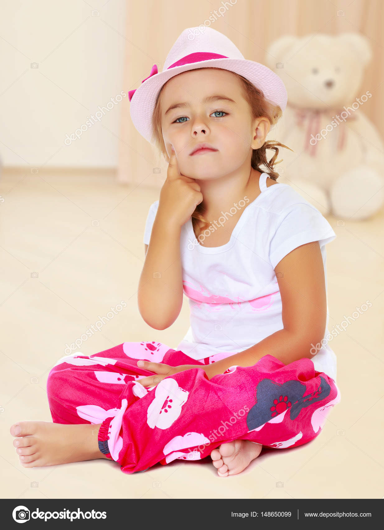 Tanned little girl in a hat — Stock Photo © lotosfoto1 #148650099