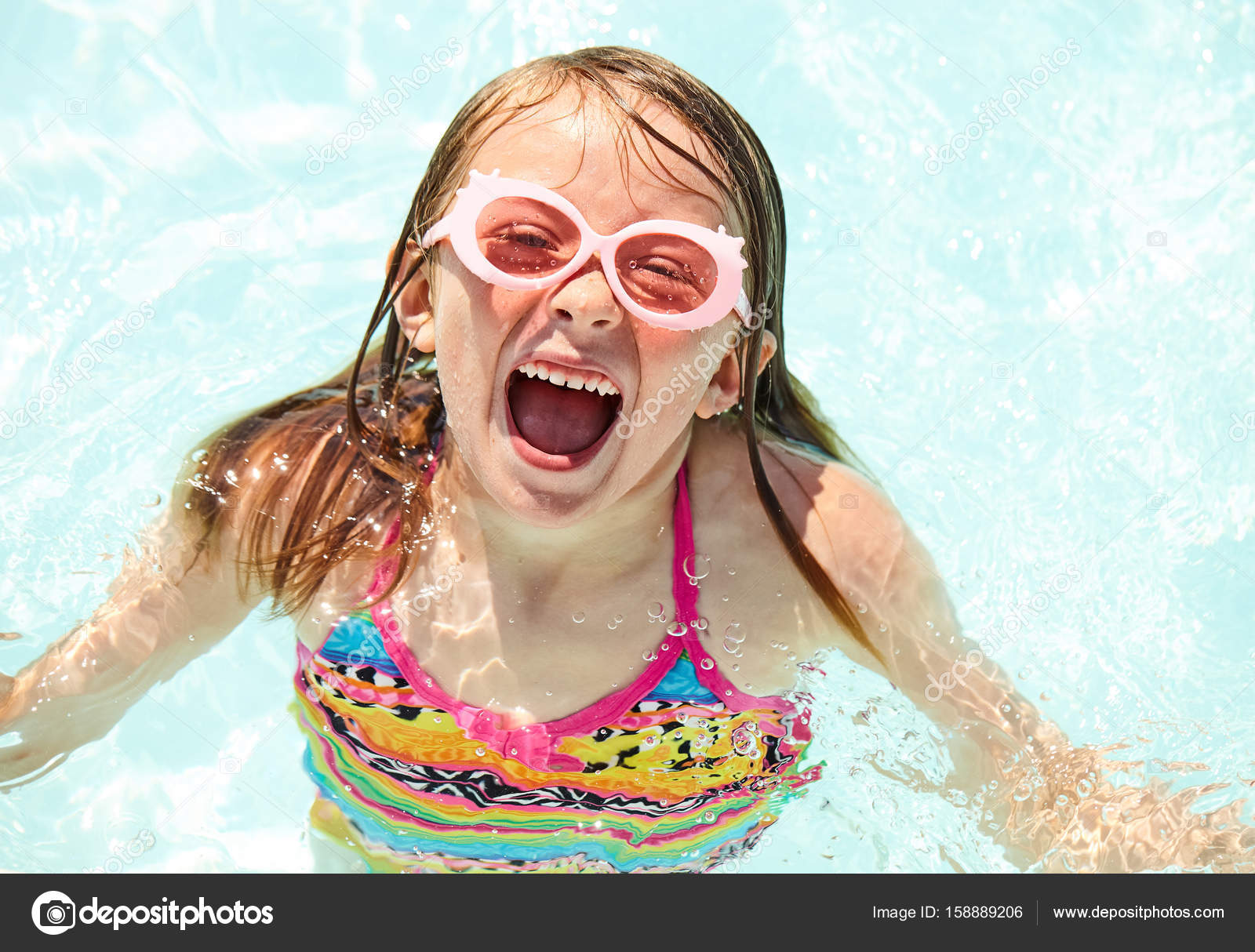 Excited girl screaming with joy in swimming pool — Stock Photo ...