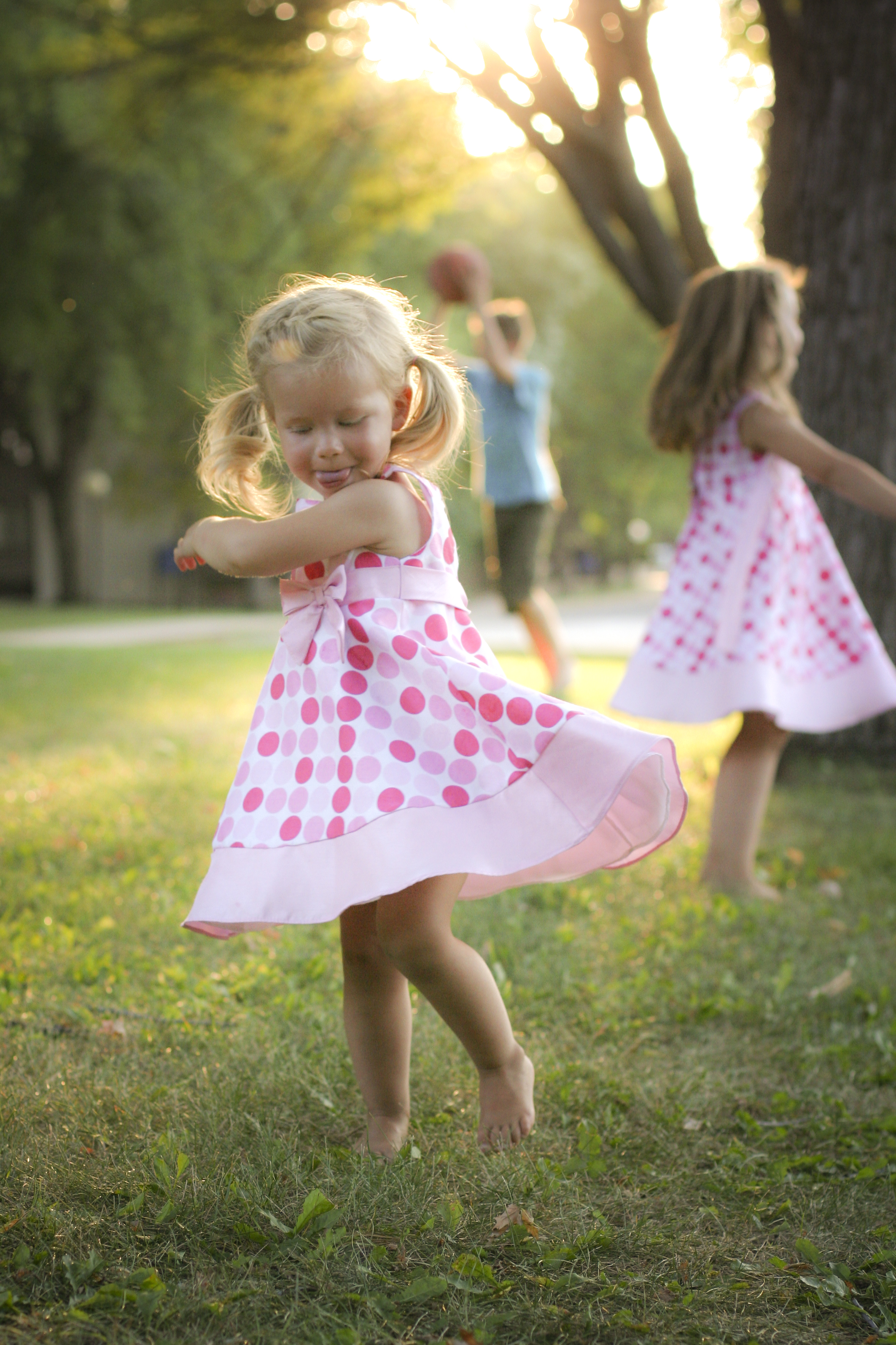 Little girl twirling photo