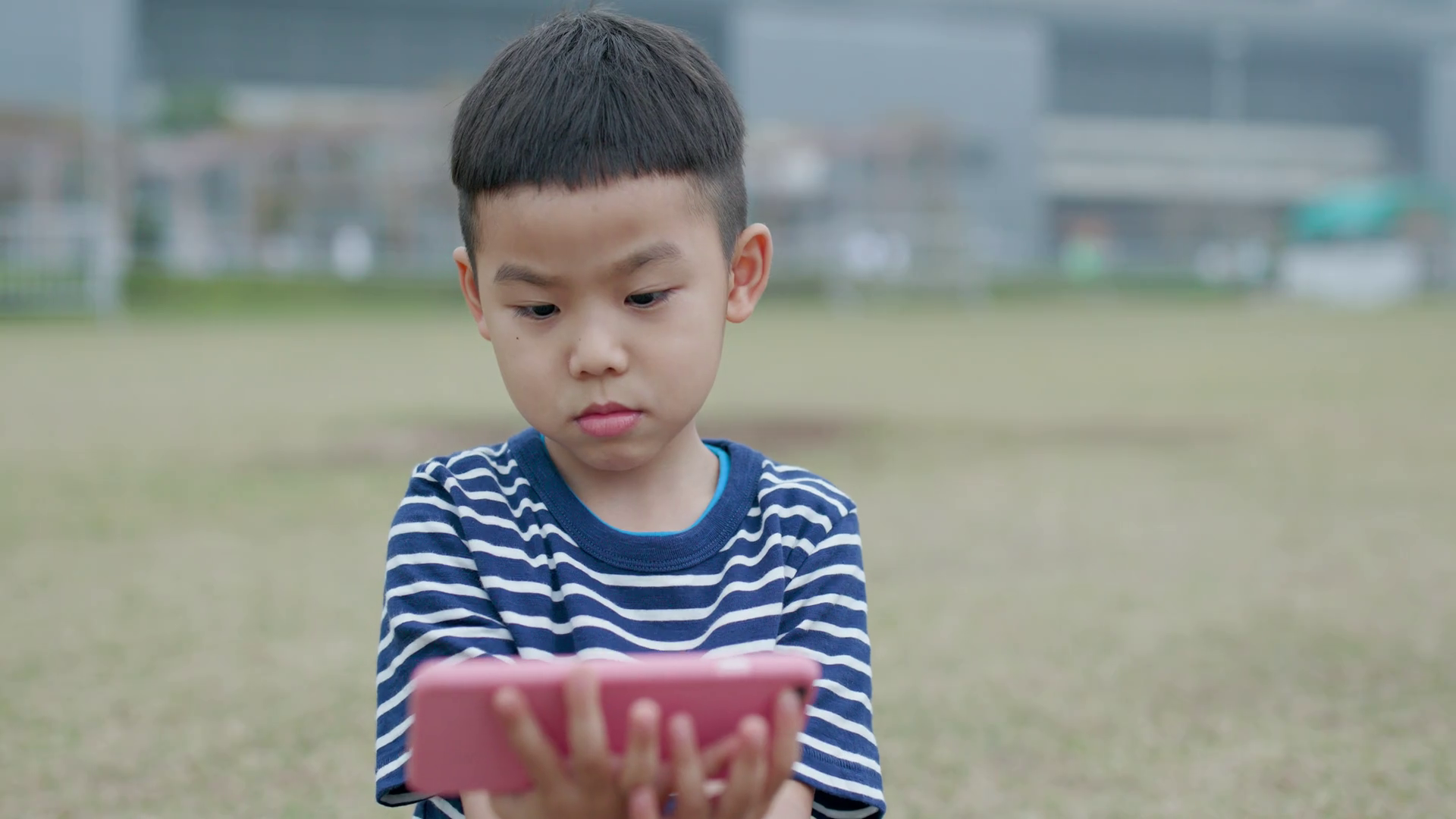 Little kid use of smart phone at outdoor Stock Video Footage ...