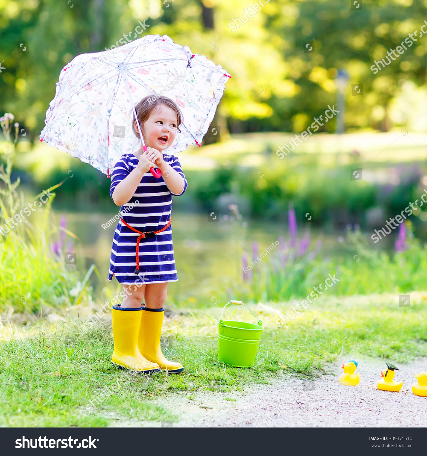 Cute Little Kid Girl Yellow Rainboots Stock Photo (Royalty Free ...