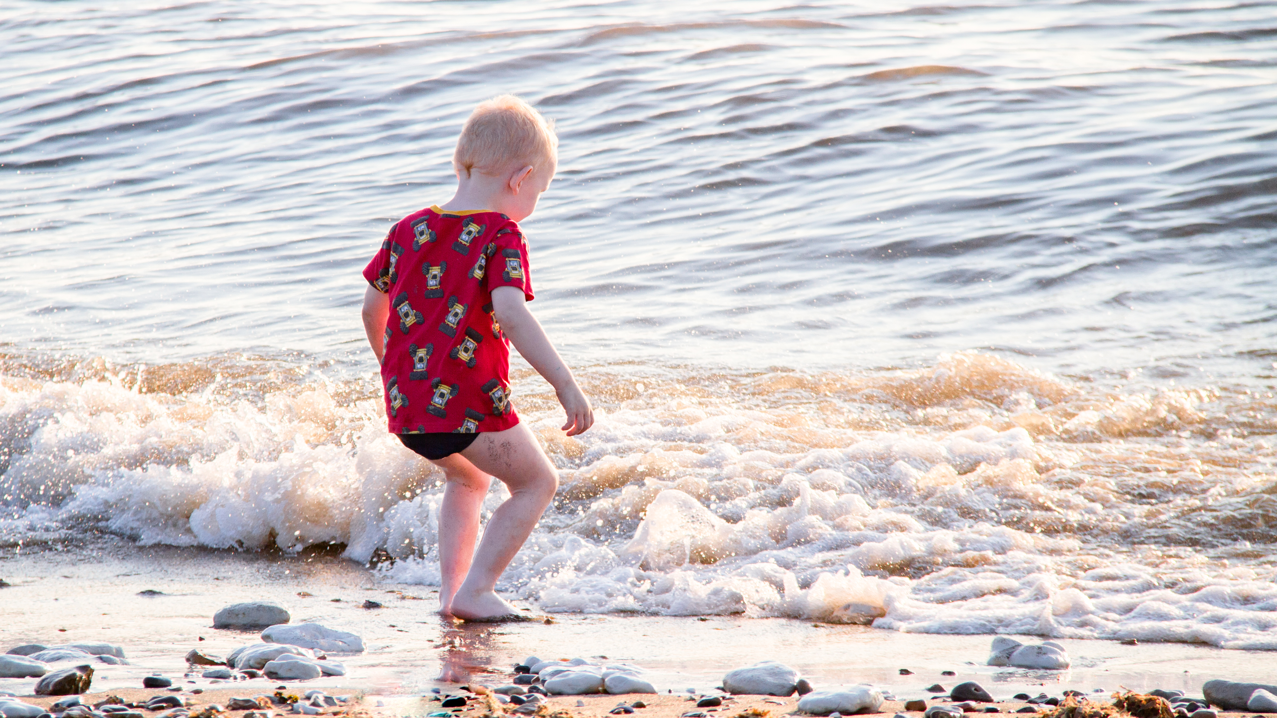 Little kid on the beach photo