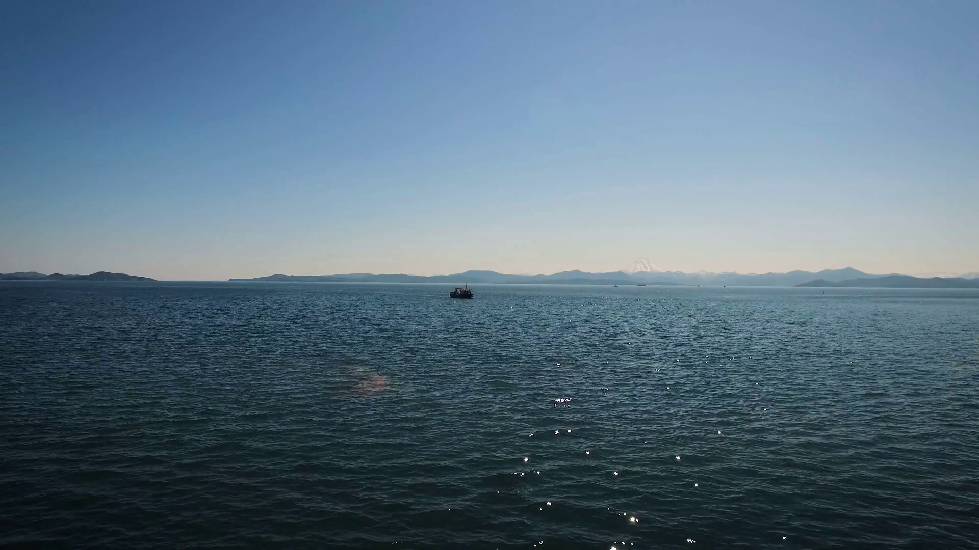 View of the lonely ship in the sea. The Bay and mountains in the ...