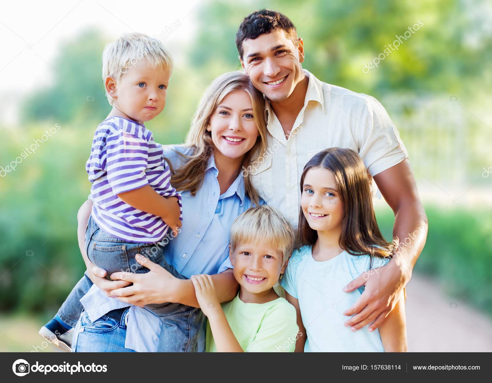 Lovely family in park — Stock Photo © billiondigital #157638114