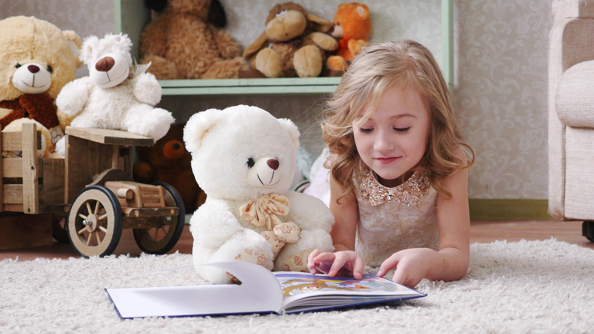 cute little girl reading a book with a teddy bear, play, have fun ...