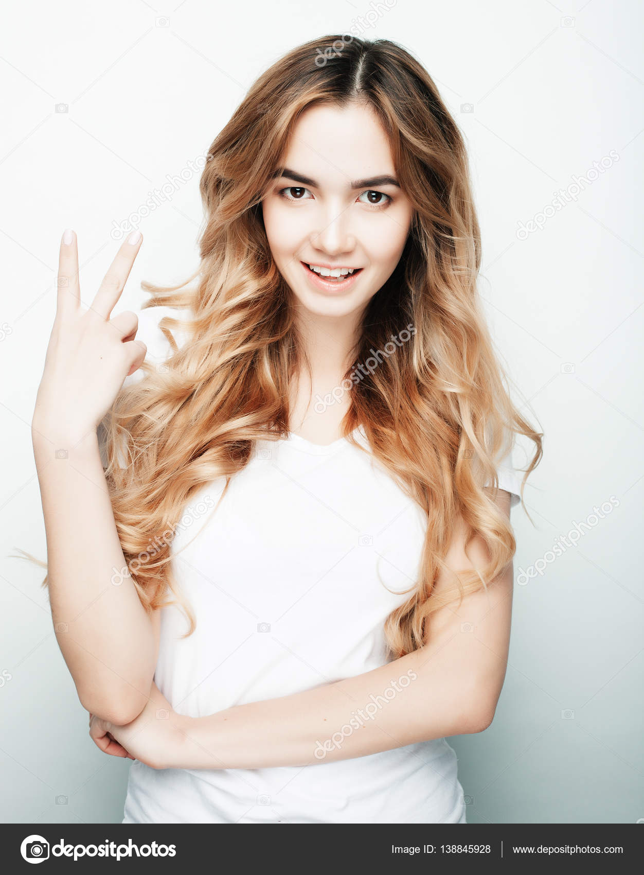 lovely woman showing victory or peace sign — Stock Photo © kanareva ...