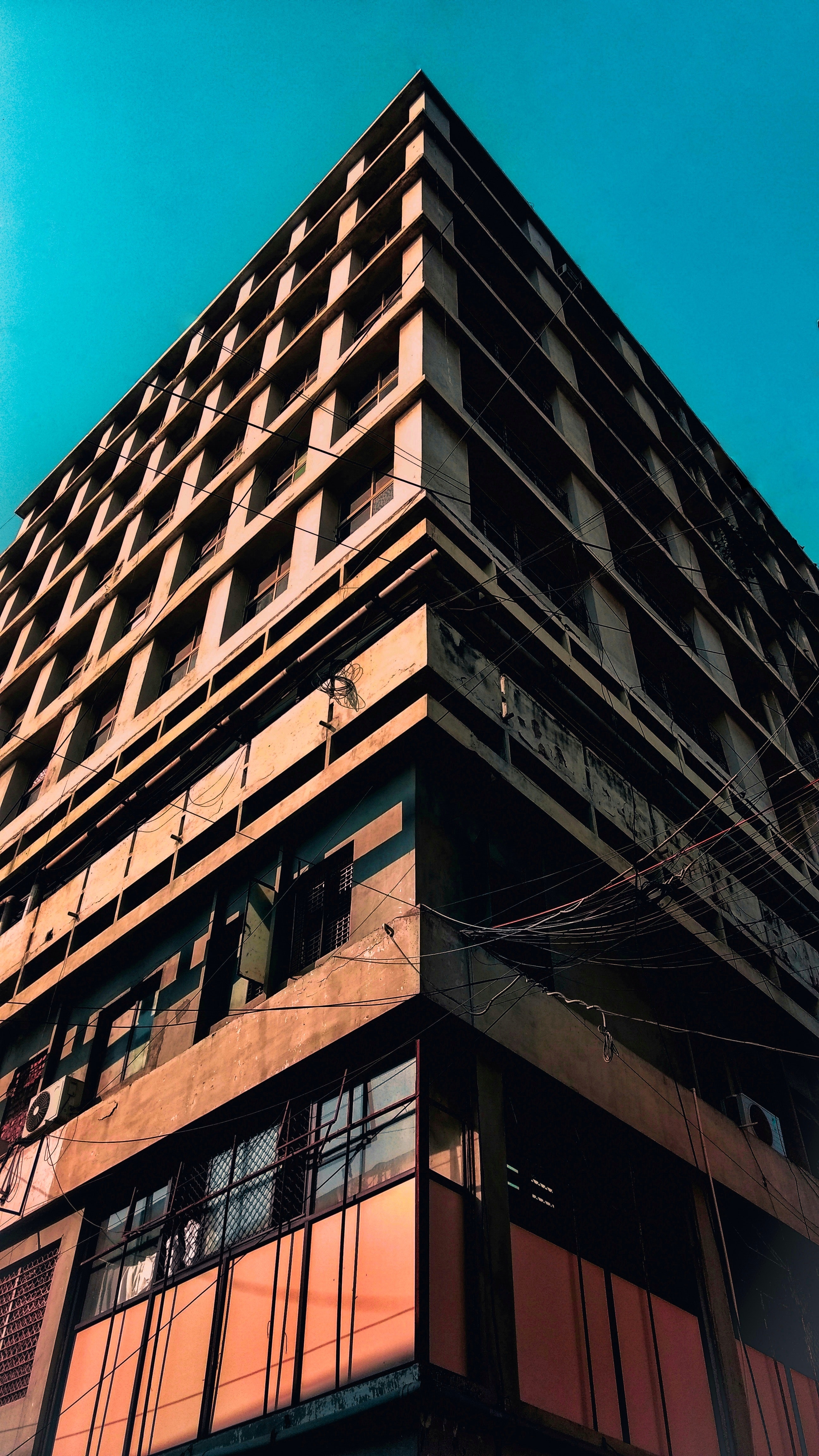 Low angle photography of brown concrete building