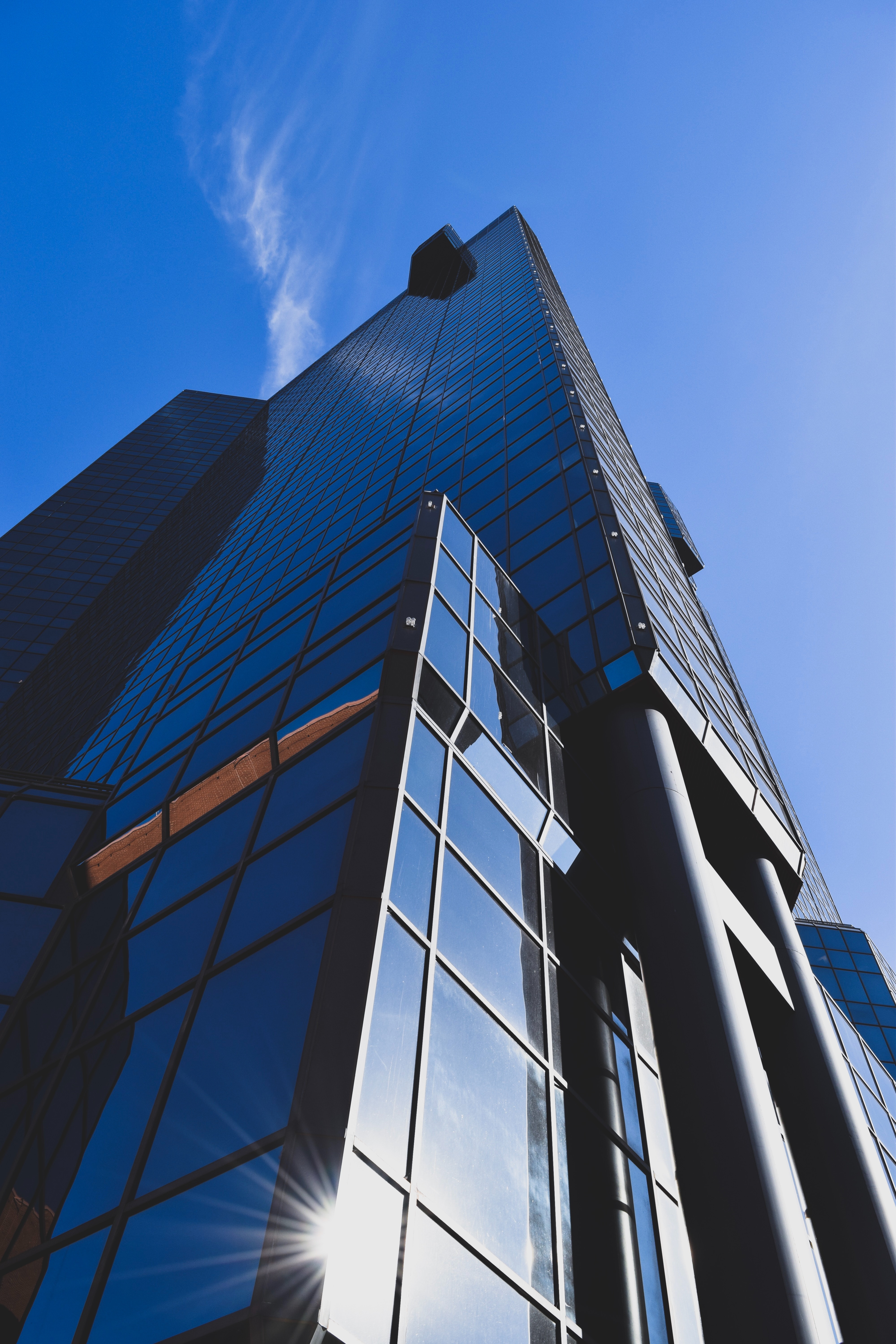 Low angle photography of glass building