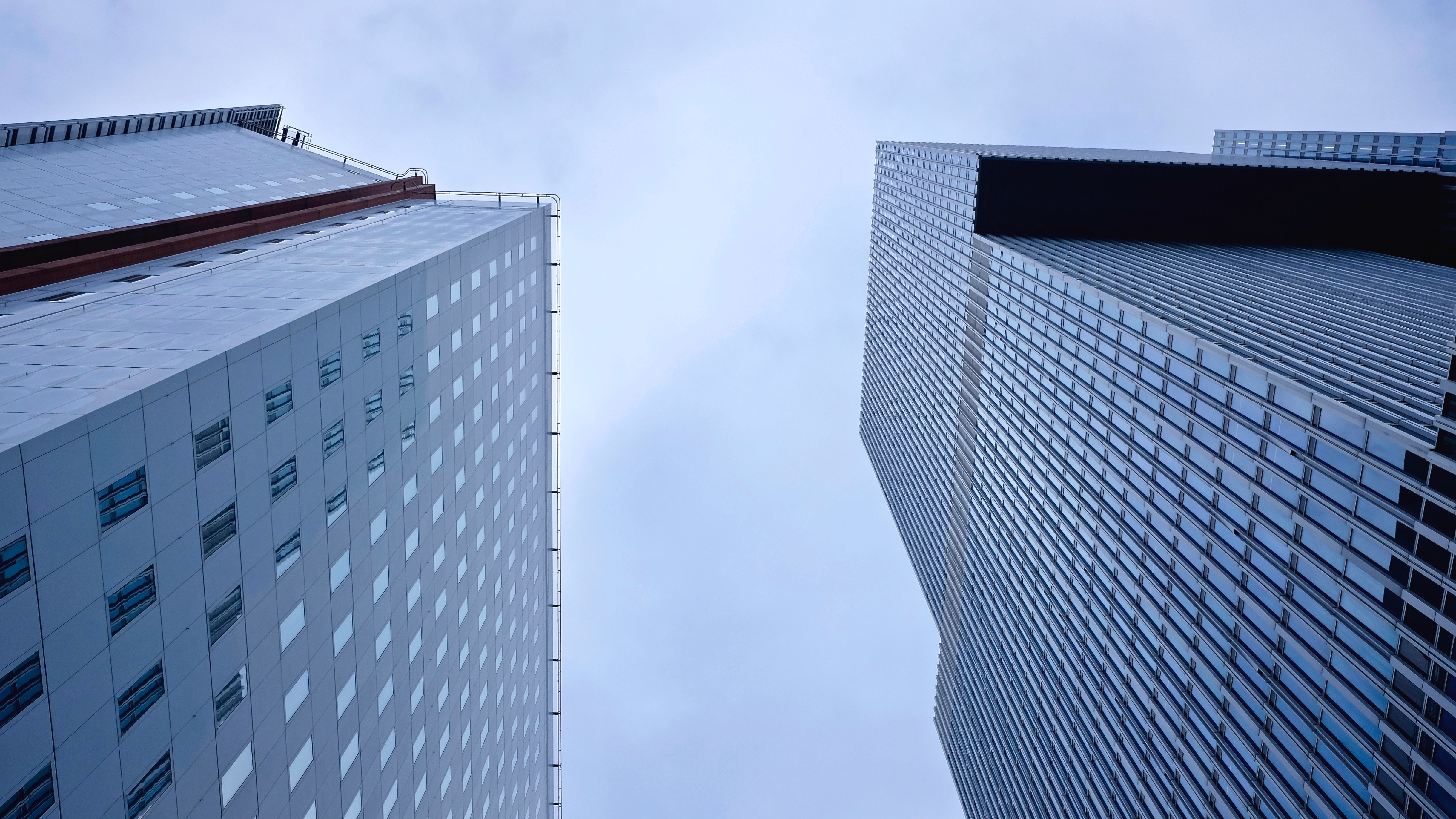 Low angle photography of skyscrapers against sky