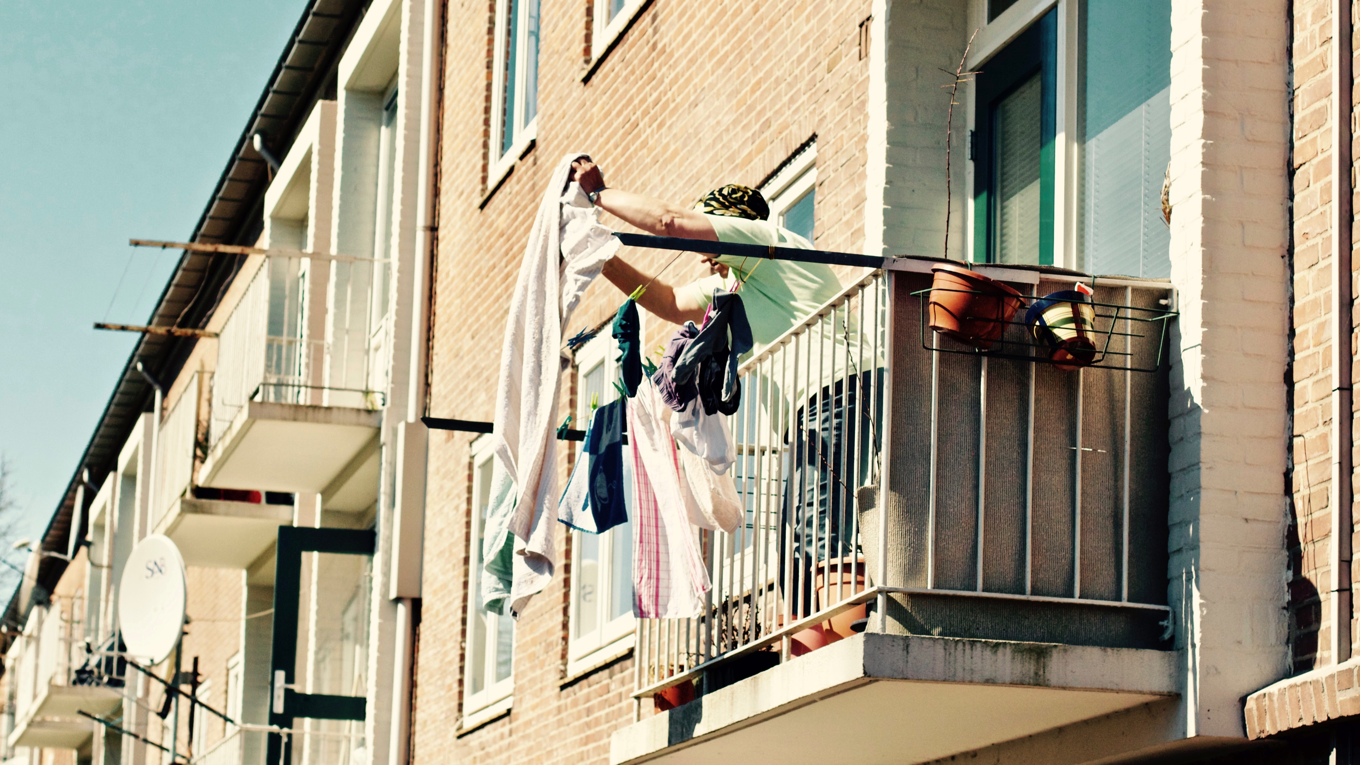 Low angle view of clothes hanging on balcony photo
