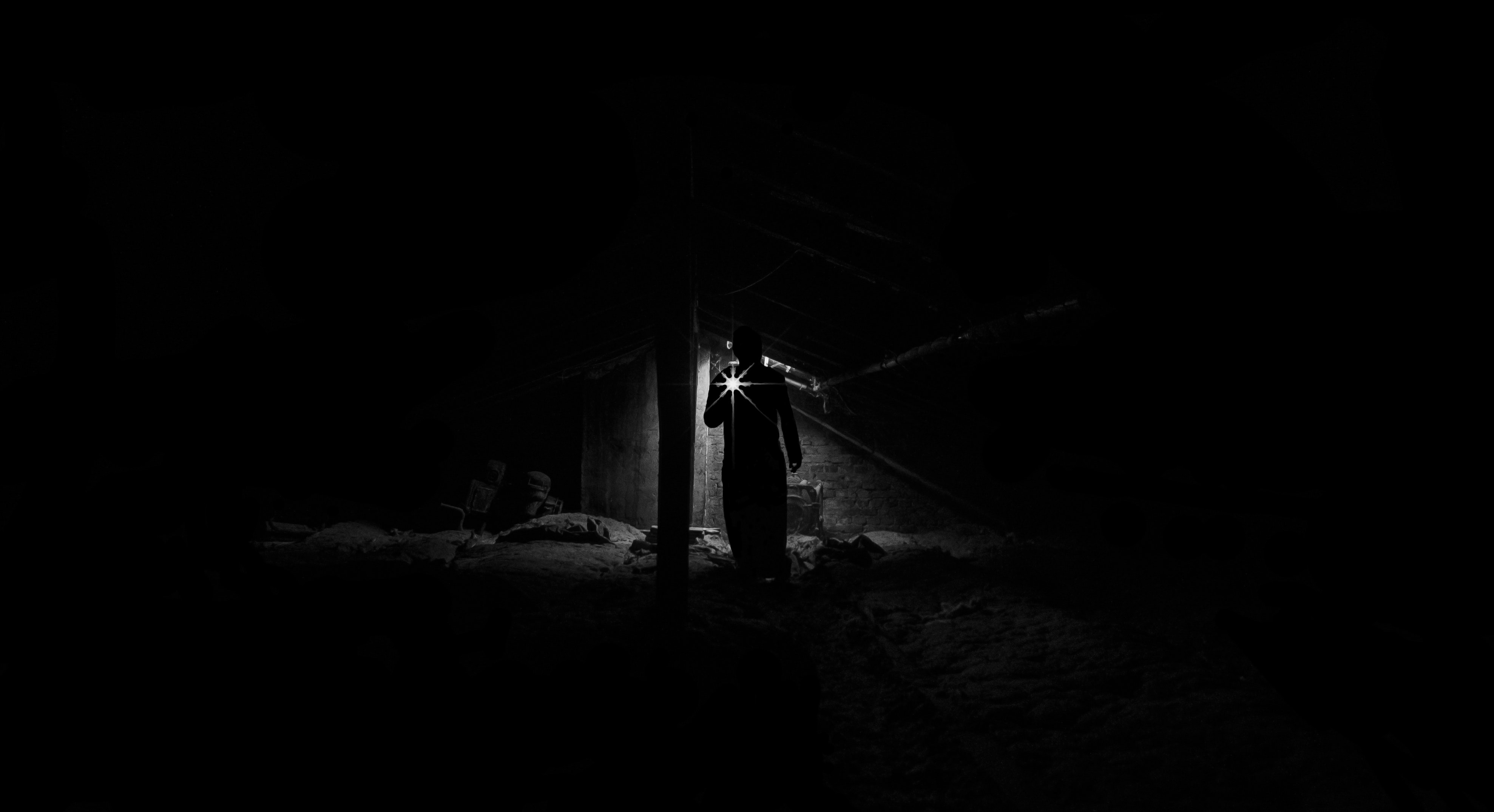 Low angle view of man standing at night photo