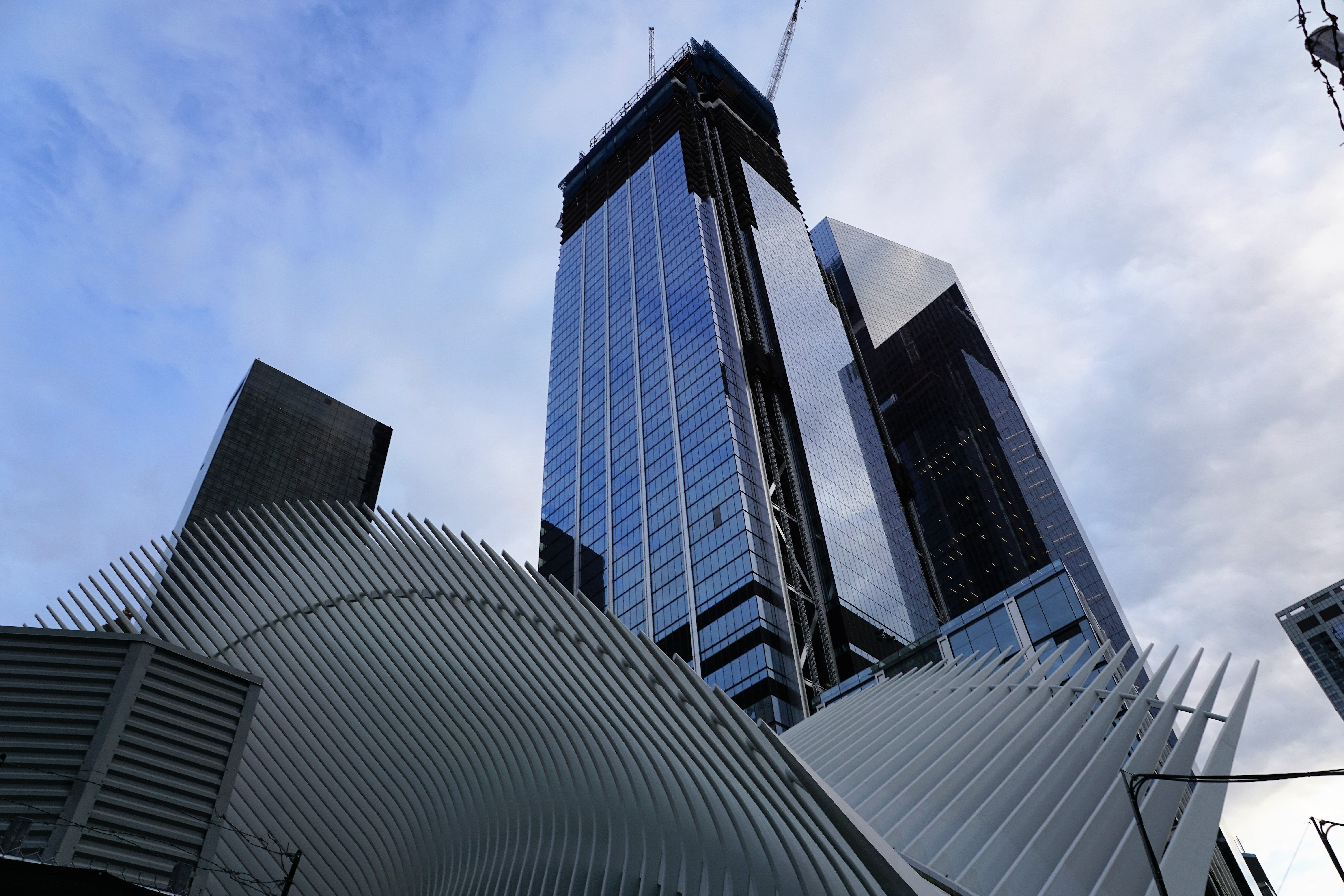 Low angle view of skyscrapers against sky photo
