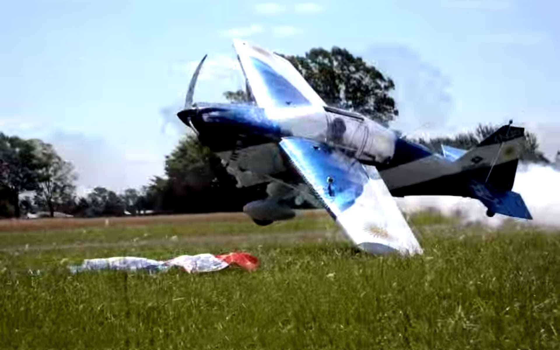 Low-Flying Plane Picks Up Flags From Ground